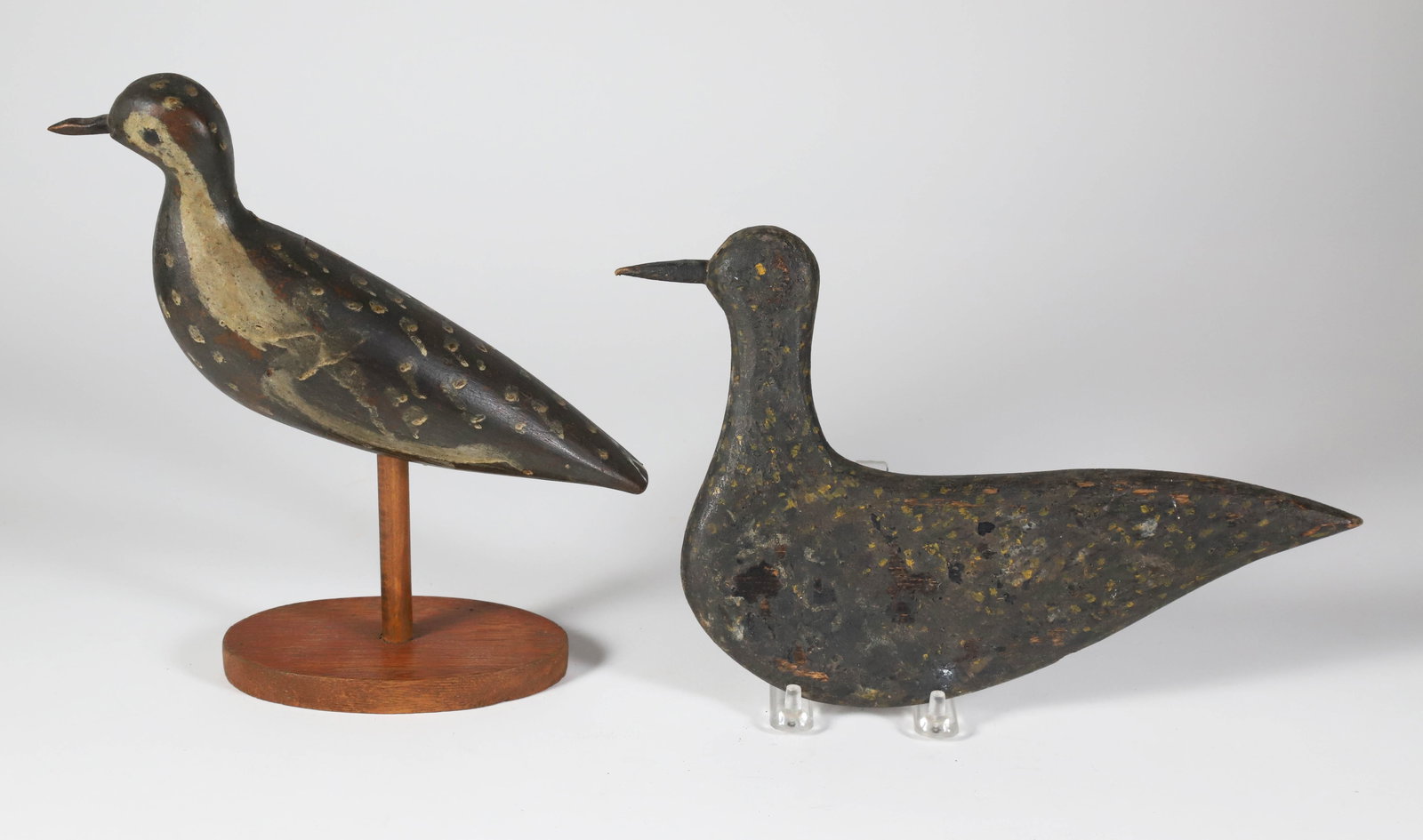 Two Antique Nantucket Carved and Painted Black Plover Decoys: Two Antique Nantucket Carved and Painted Black Plover Decoys Smaller plover: 9 in. x 7 in. Larger plover: 8 in. x 10 in.