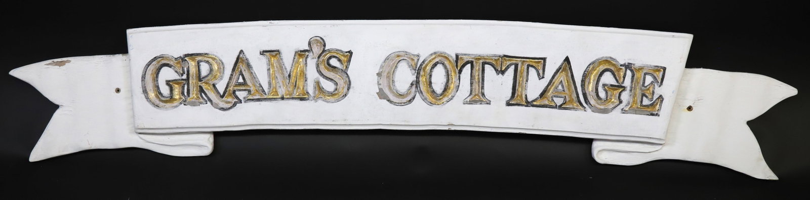 Vintage Gram’s Cottage Carved and Painted Quarterboard Sign: "Vintage Gram’s Cottage Carved and Painted Quarterboard Sign, wood scroll form with carved and gilt decorated letters. Height 9 in. Width 53.5 in."