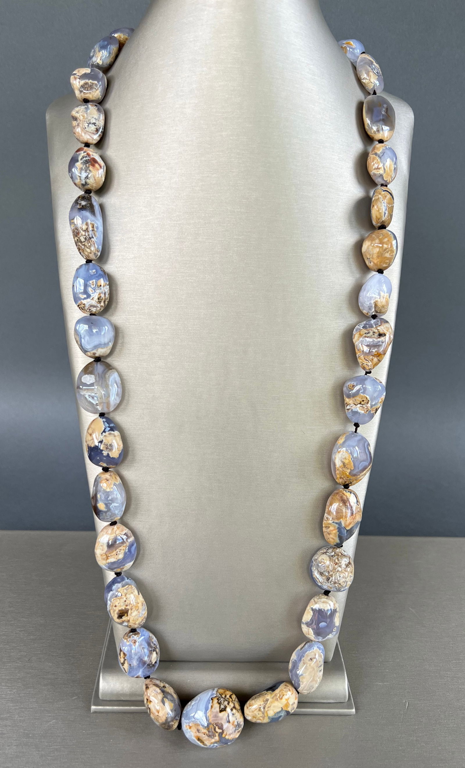 Polished Chalcedony Stone Graduated Nugget Necklace: Polished Chalcedony Stone Graduated Nugget Necklace, hammered sterling silver toggle clasp Length 34 in.