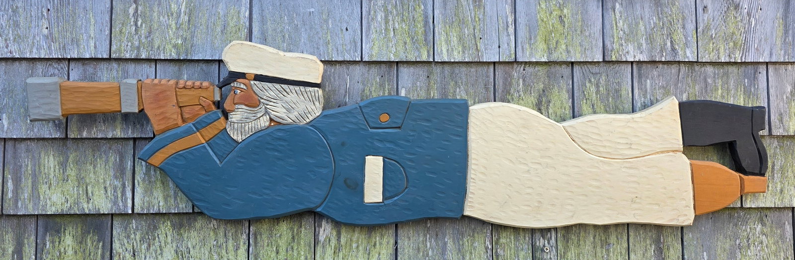 David Small Carved & Painted Folk Art Nantucket Sea Captain Plaque: David Small Carved & Painted Folk Art Nantucket Sea Captain Plaque, with peg leg, carved wood with painted decoration, signed with stamp on reverse. 11.5 in x 45 in.