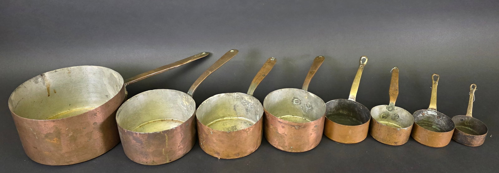Nest of Eight Antique / Vintage Copper Pots: Nest of Eight Antique / Vintage Copper Pots From Height 4.5 in. Length 17.5 in. Diameter 8.25 in. To Diameter 2.75 in.