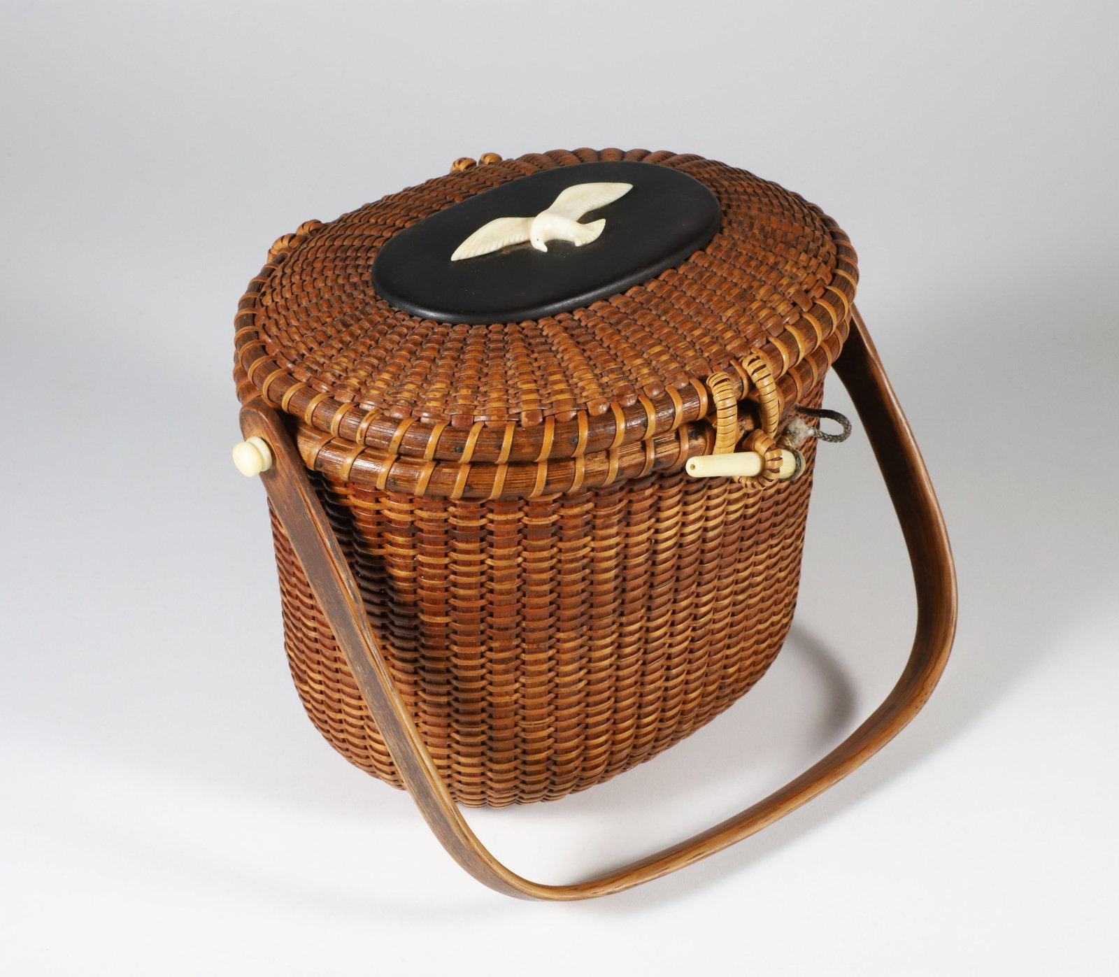 Sherwin Boyer Nantucket Friendship Basket, circa 1950s: Sherwin Boyer (1907-1964) Nantucket Friendship Basket, circa 1950s, ebony top with carved seagull, branded Boyer signature on the base Height 6 in. Width 7.5 in. Depth 6 in.