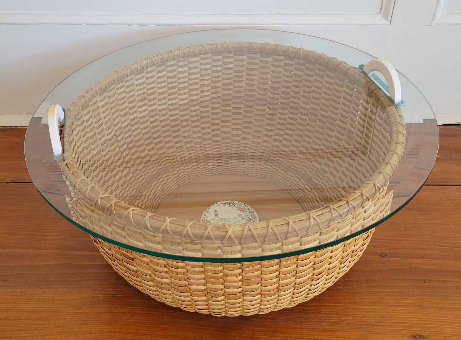 Susan Akers Crafted Nantucket Basket Coffee Table with Interior Scrimshawed Disc by Lee Ann Papale: Susan Akers Crafted Nantucket Basket Coffee Table with Interior Scrimshawed Polychrome Disc by Lee Ann Papale, 1996, the engraved disc depicting Sankaty Lighthouse and terns, with custom glass top, si
