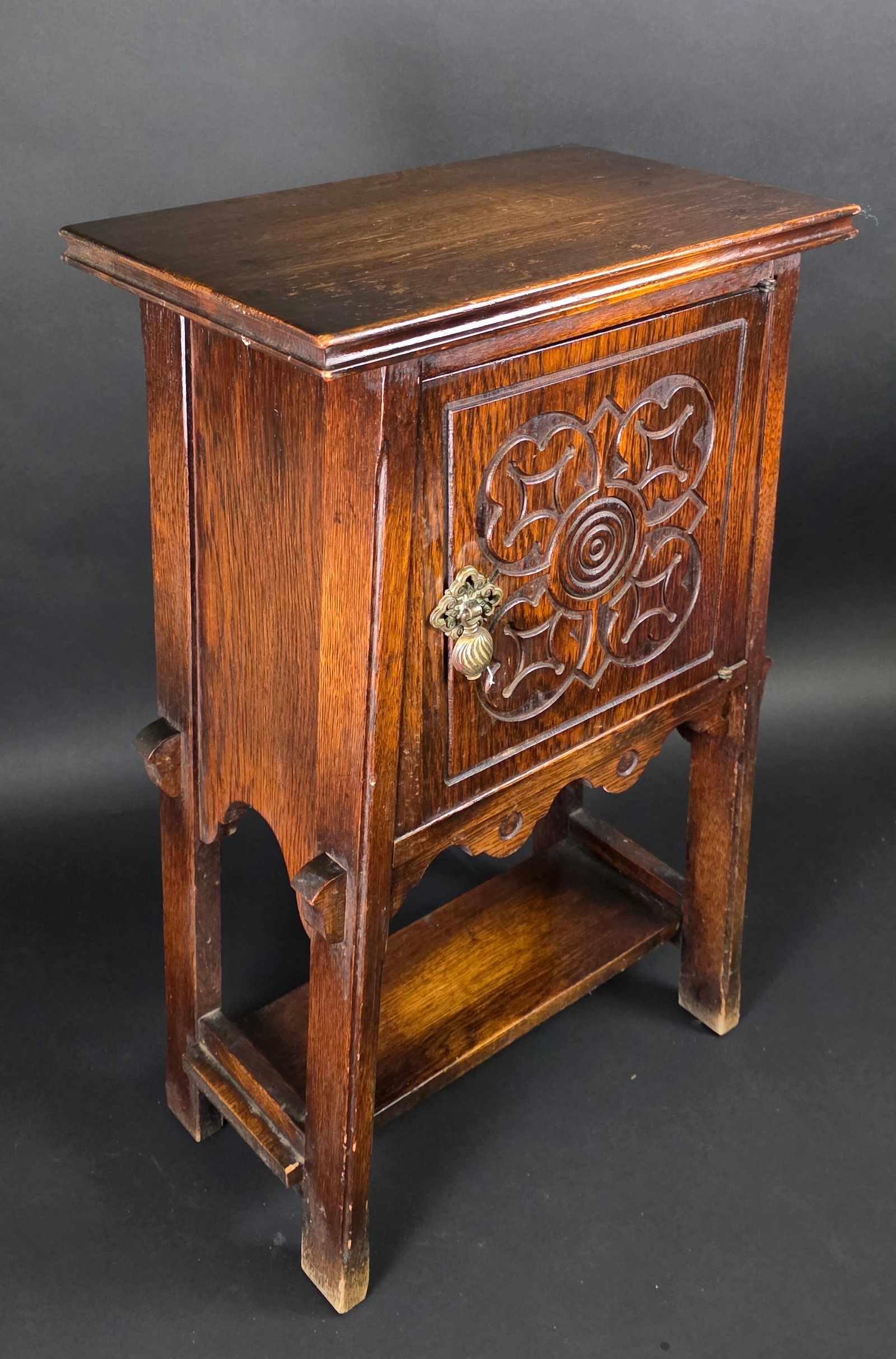 Antique English Oak Humidor Smoking Cabinet: Antique English Oak Humidor Smoking Cabinet, a carved hinged door exposing a tin lined cigar safe, with shelf stretcher, joint and peg construction, original makers label, Ferguson F.B.M. Co. Hoboken