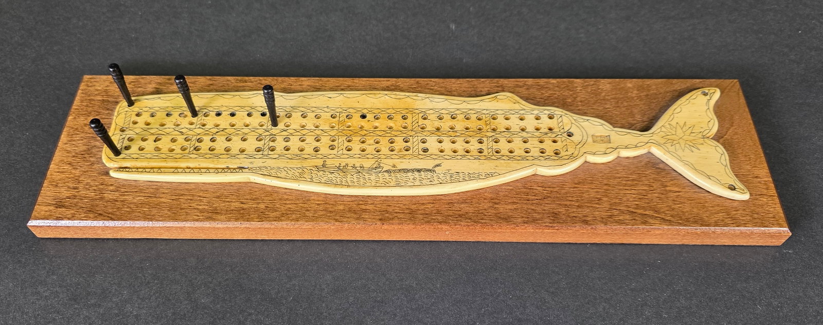 Figural Sperm Whale Cribbage Board: Figural Sperm Whale Cribbage Board, resin copy, faux scrimshaw. 3.5 in. X 13 in.
