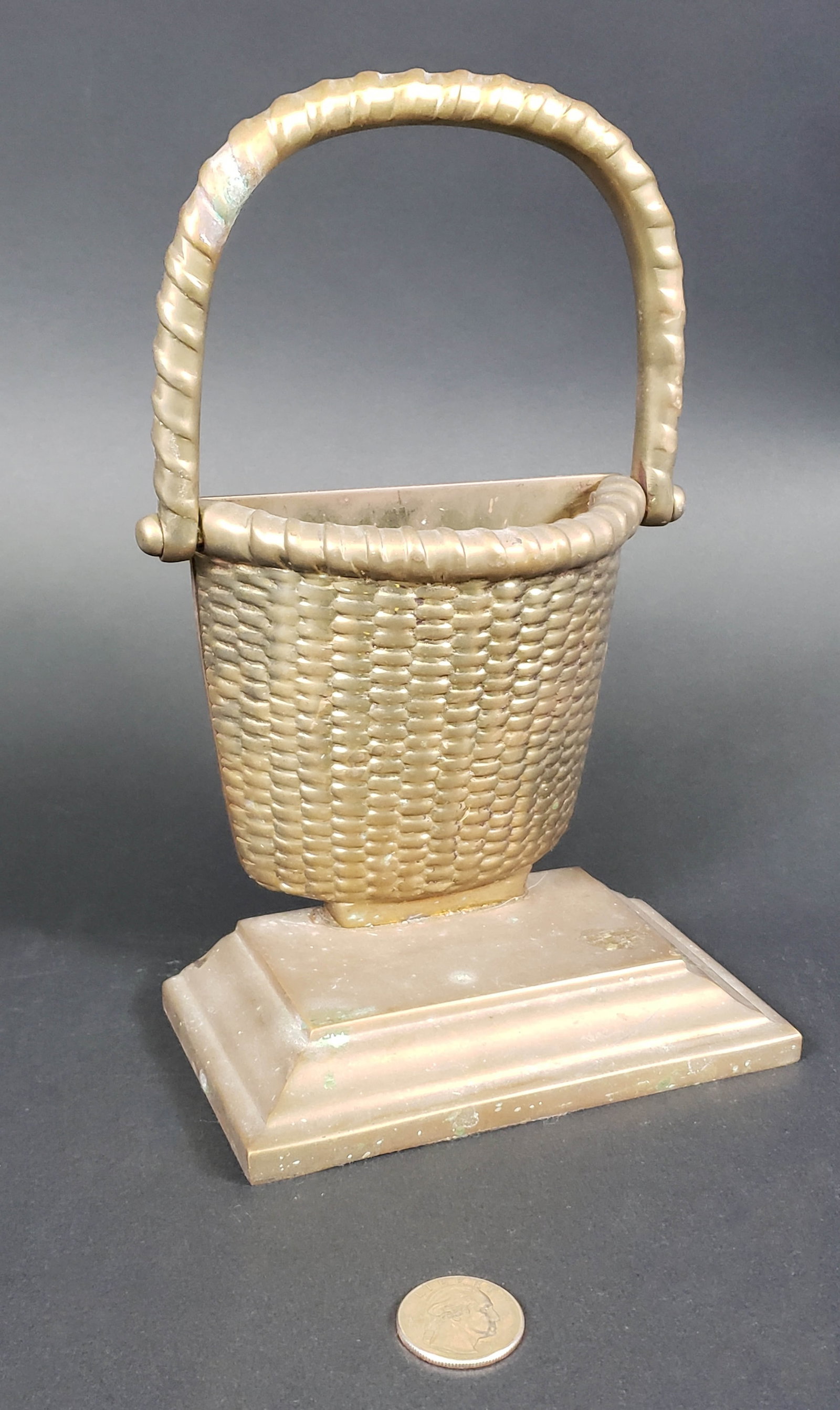 Vintage Brass Nantucket Basket Doorstop: Vintage Brass Nantucket Basket Doorstop, on graduated plinth base. Height 9.5 in. Width 5.5 in. Depth 3.25 in.