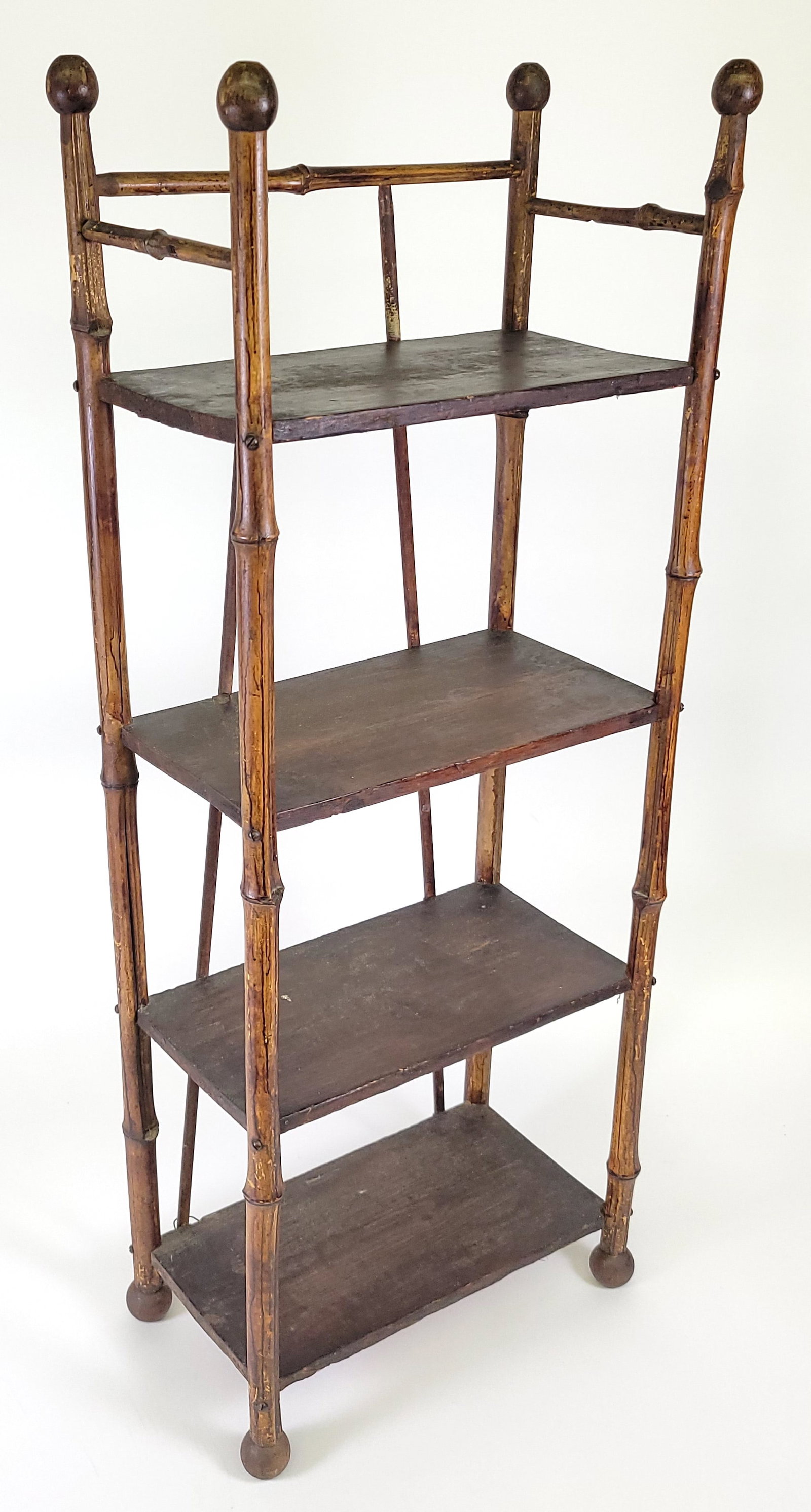 Antique Aesthetic Movement Bamboo and Pine Etagere Bookshelf: Antique Aesthetic Movement Bamboo and Pine Etagere Bookshelf, 19th century, diminutive size, four decorated pine shelves, ball finials and bamboo construction. Height 35 in. Width 14 in. Depth 7.5 in.