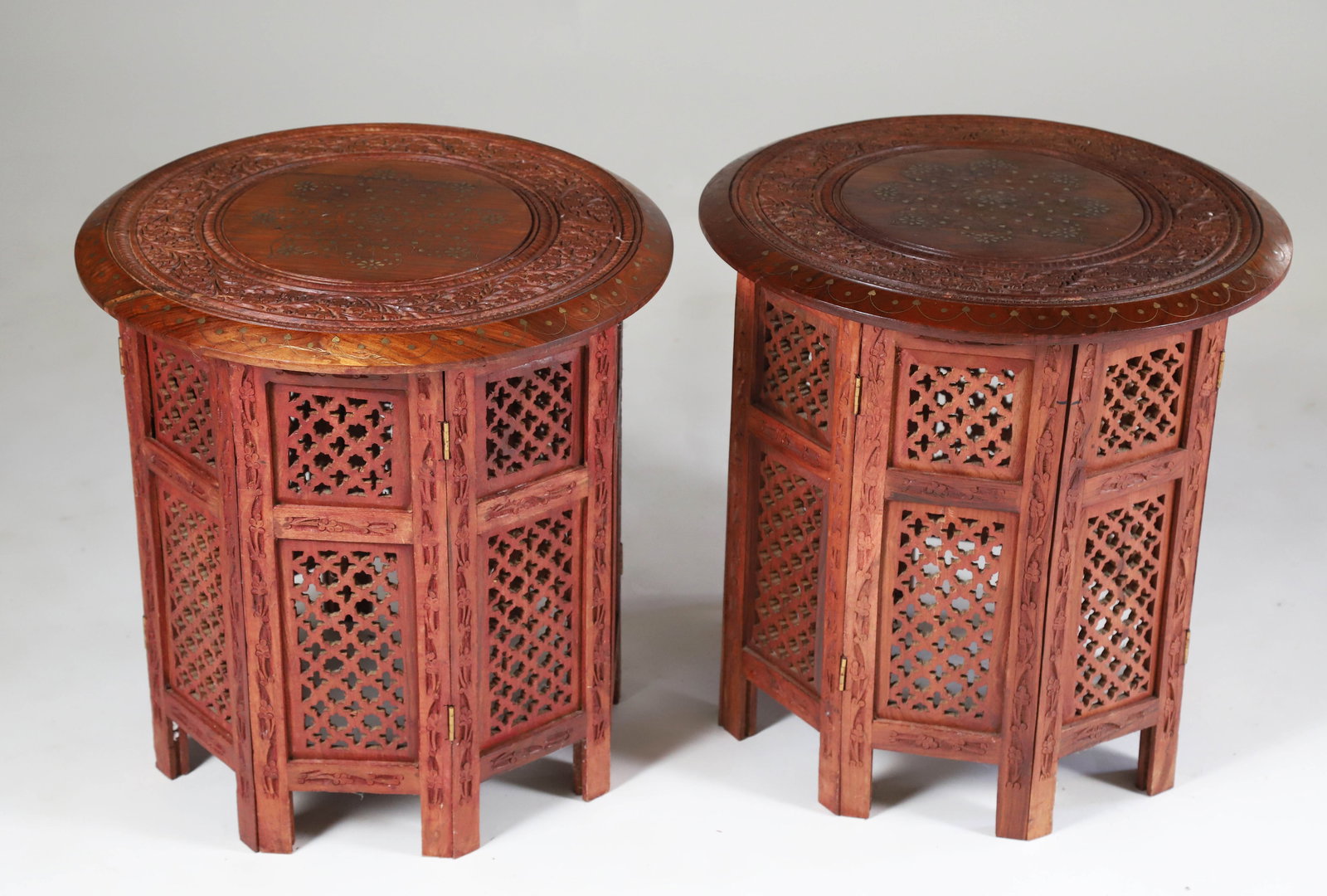 Pair of Teak Wood Brass Inlaid Side Tables: Pair of Teak Wood Brass Inlaid Side Tables, circular tops on pierced octagonal bases Height 19 in. Diameter 18 in.
