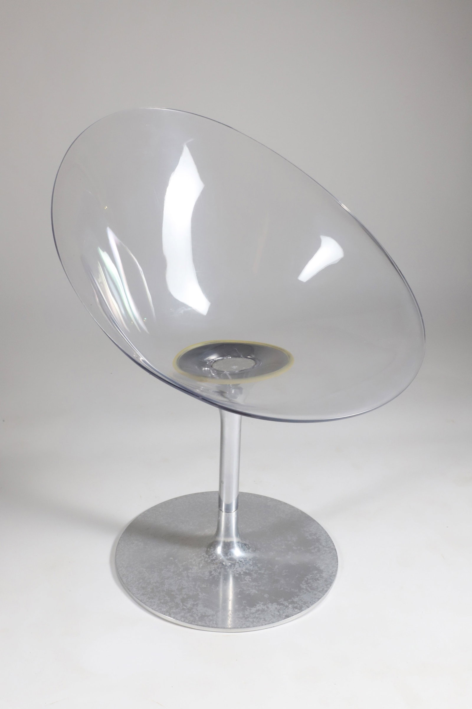 Ero|s| by Kartell with Starck Plastic Contemporary Swivel Armchair Designed by Philippe Starck: Ero|s| by Kartell with Starck Plastic Contemporary Swivel Armchair Designed by Philippe Starck, featuring a transparent polycarbonate seat and a polished aluminum base Height 31 in. Width 24 in. Depth