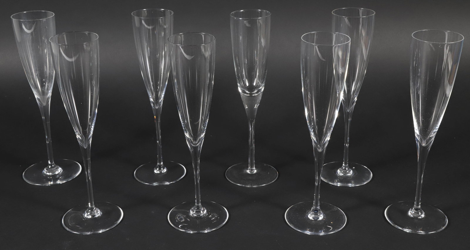 Seven Baccarat Champagne Flutes: Seven Baccarat Champagne Flutes Height 11 in. Provenance: The Estate of Carole Webster, Nantucket Island, Massachusetts