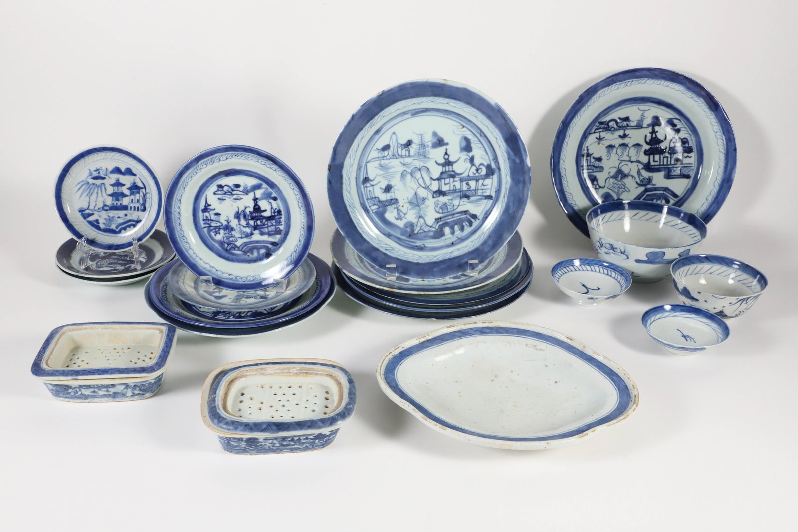 Collection of 22 Assorted Pieces of Blue and White Canton, 19th Century: Collection of 22 Assorted Pieces of Blue and White Canton, 19th Century 13 plates 4 bowls 2 two part soap dishes one tureen insert5.5 in. to 10.5 in.