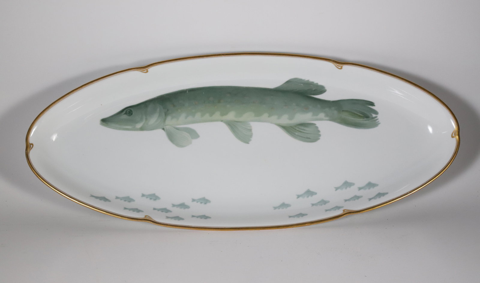 Thomas Bavaris Porcelain Fish Platter: Thomas Bavaris Porcelain Fish Platter, signed underneath: Albert Mollweide Benburg #2312, depicting a muskellunge, the largest member of the pike family 10 in. x 24 in.