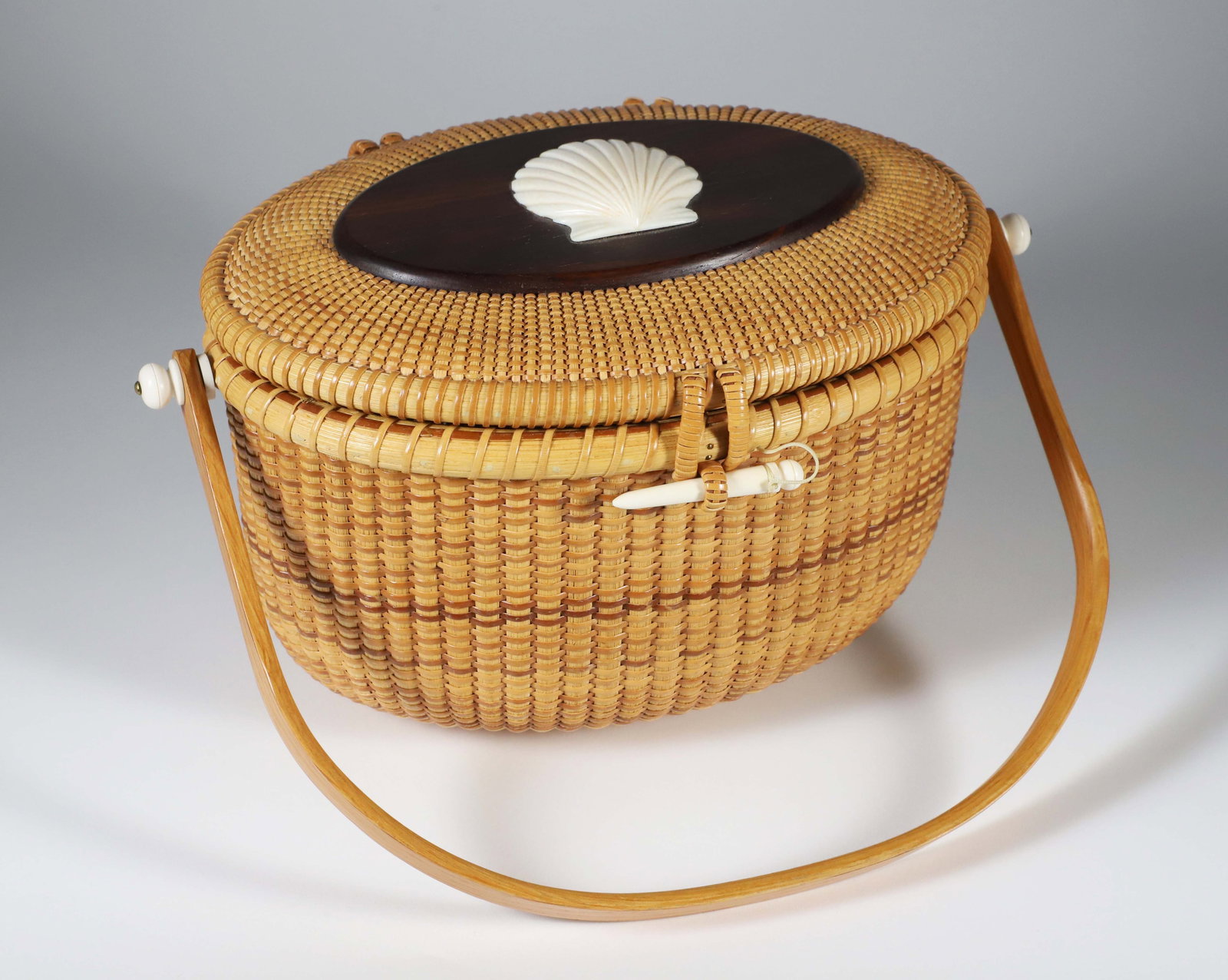 Donna Cifranic Nantucket Friendship Basket: Donna Cifranic Nantucket Friendship Basket with Carved Scallop Shell on Ebony Lid, signed upon the base Donna Cifranic, Nantucket Island 1990 Height 7 in. Width 9.5 in. Depth 8 in.