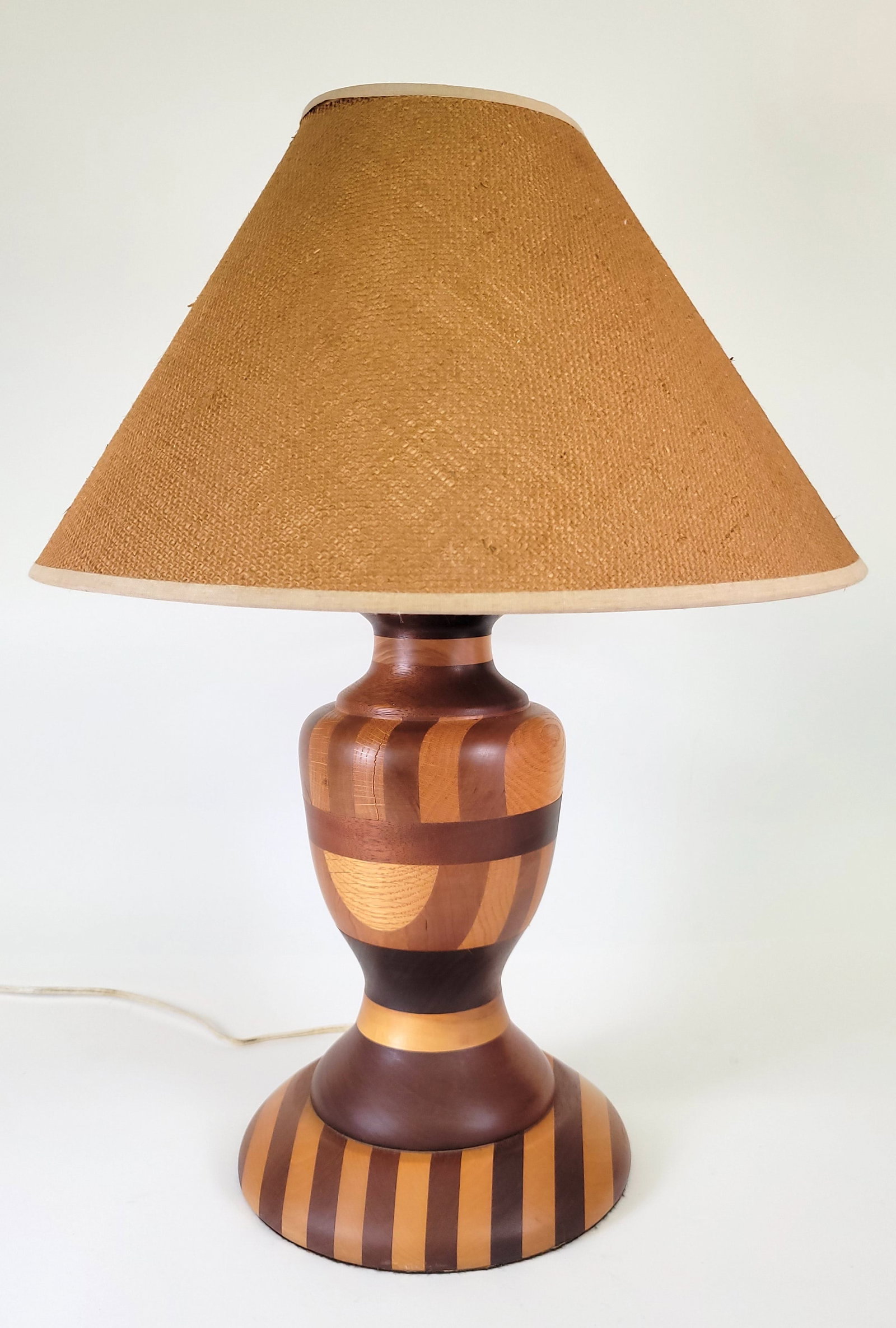 Vintage Folk Art Multiwood Inlaid Table Lamp: Vintage Folk Art Multiwood Inlaid Table Lamp, 20th century, multiple species of contrasting woods in turned vase form standard. Overall height 23.5 in.