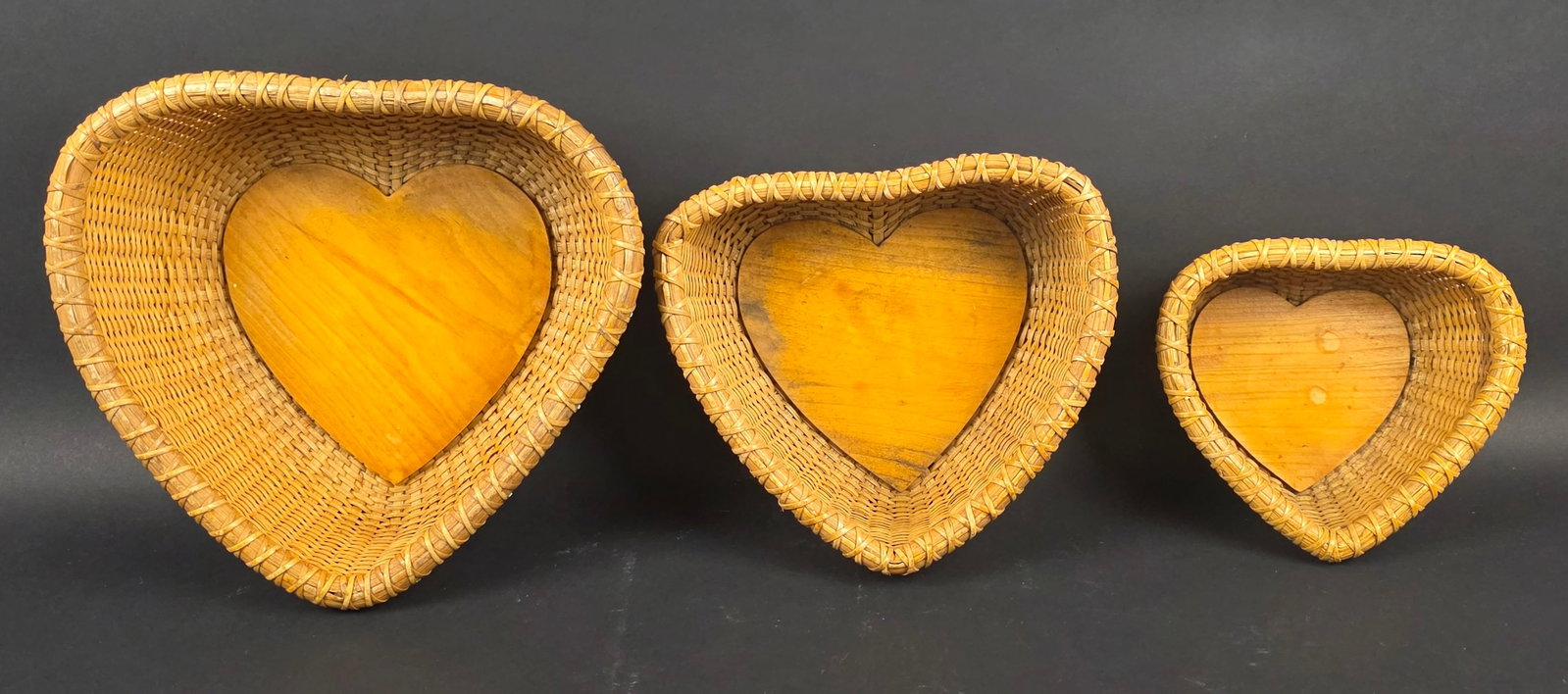 Vintage Heart Shaped Nest of Nantucket Baskets, 20th century: Vintage Heart Shaped Nest of Nantucket Baskets, 20th century, three total Height From Height 3 in. Width 6.75 in. Depth 6 in. To Height 4 in. Width 10 in. Depth 9.5 in.