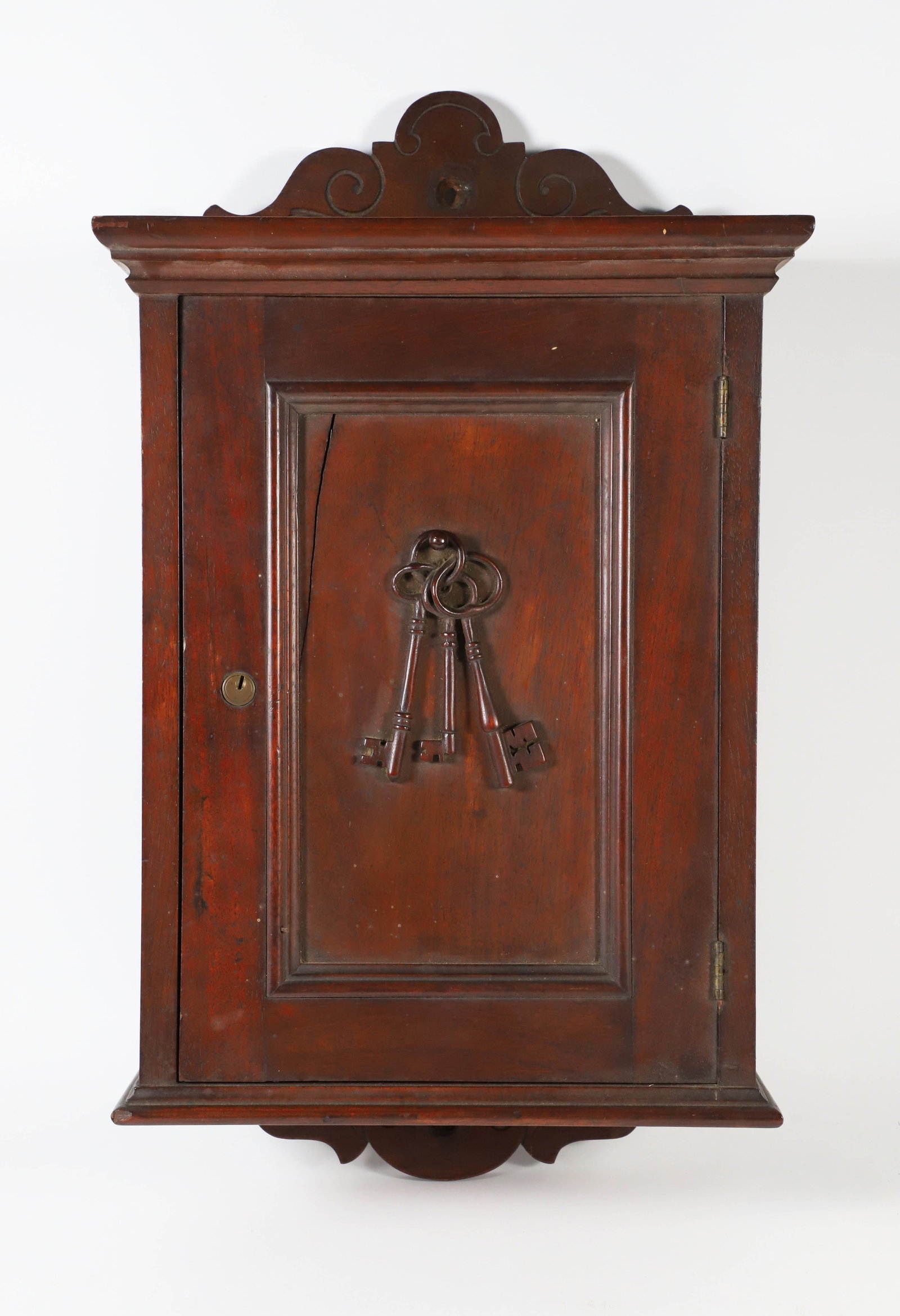 Vintage Mahogany Hanging Key Cabinet: Vintage Mahogany Hanging Key Cabinet, with relief carved keys on the front Height 21 in. Width 12 in. Depth 5 in.