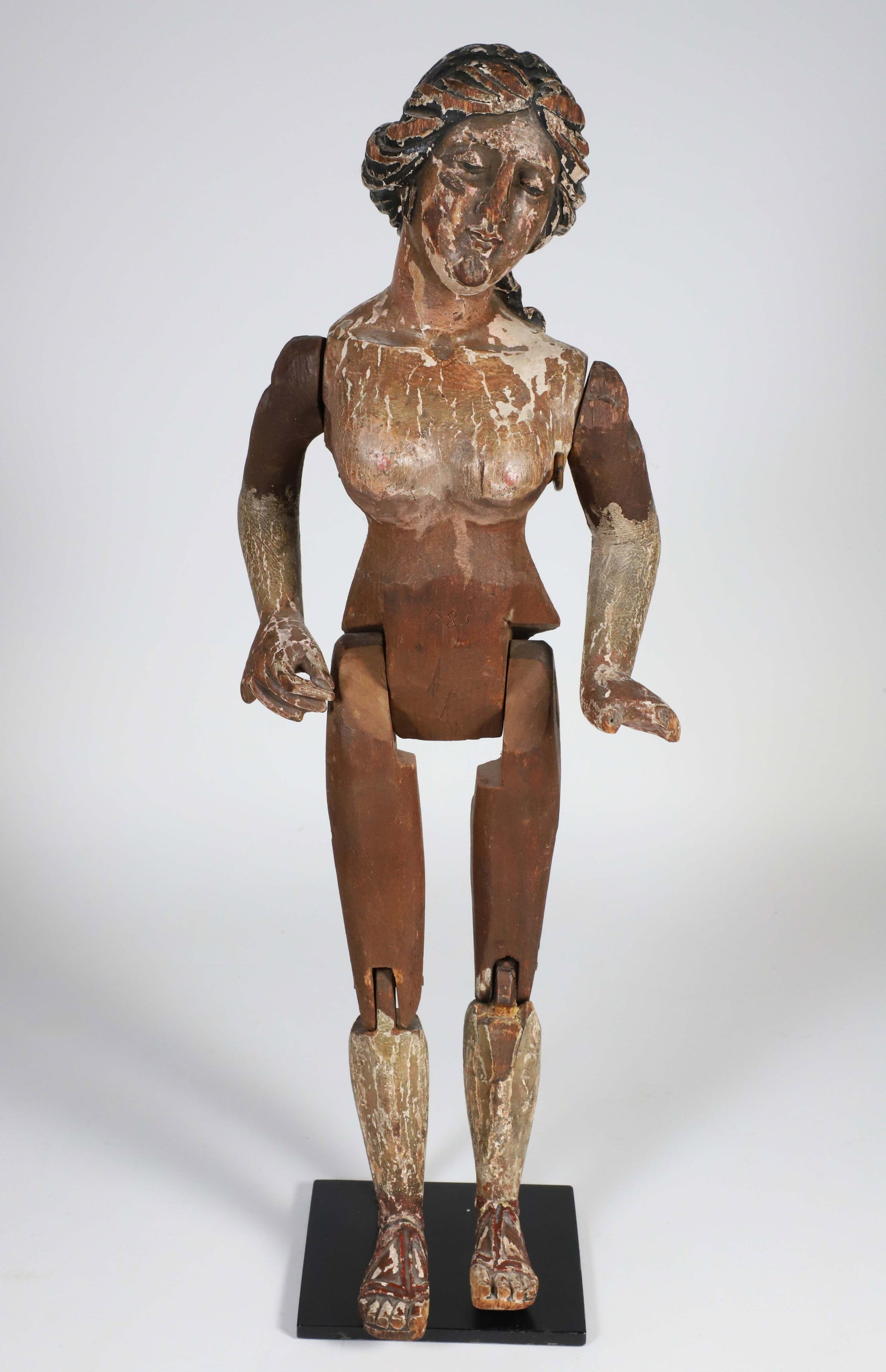 Articulated Carved Female Sculpture Wearing Sandals, 19th Century: Articulated Carved Female Sculpture Wearing Sandals, 19th Century. Height 19 in.