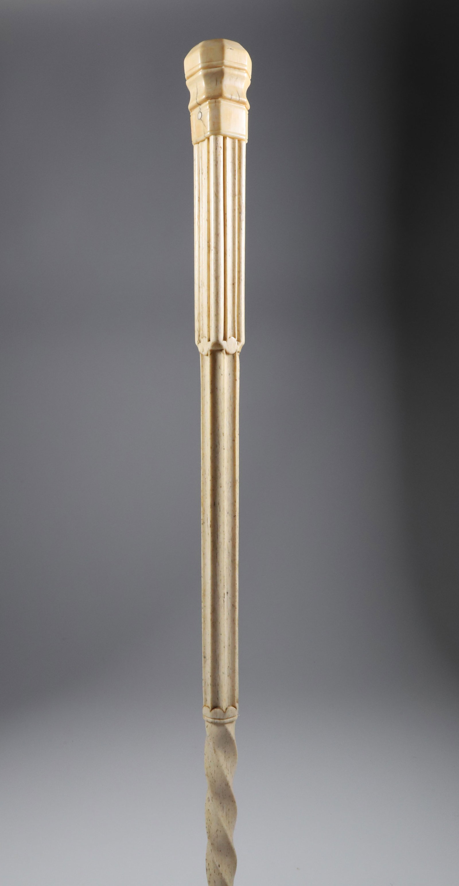 Whaler Made Capstan Grip Walking Stick, mid 19th Century: Whaler Made Capstan Grip Walking Stick, mid 19th Century, antique whale ivory carved capstan grip above a whale bone shaft with carved columns, fluting and broad tapering twist. **Note: This item is n