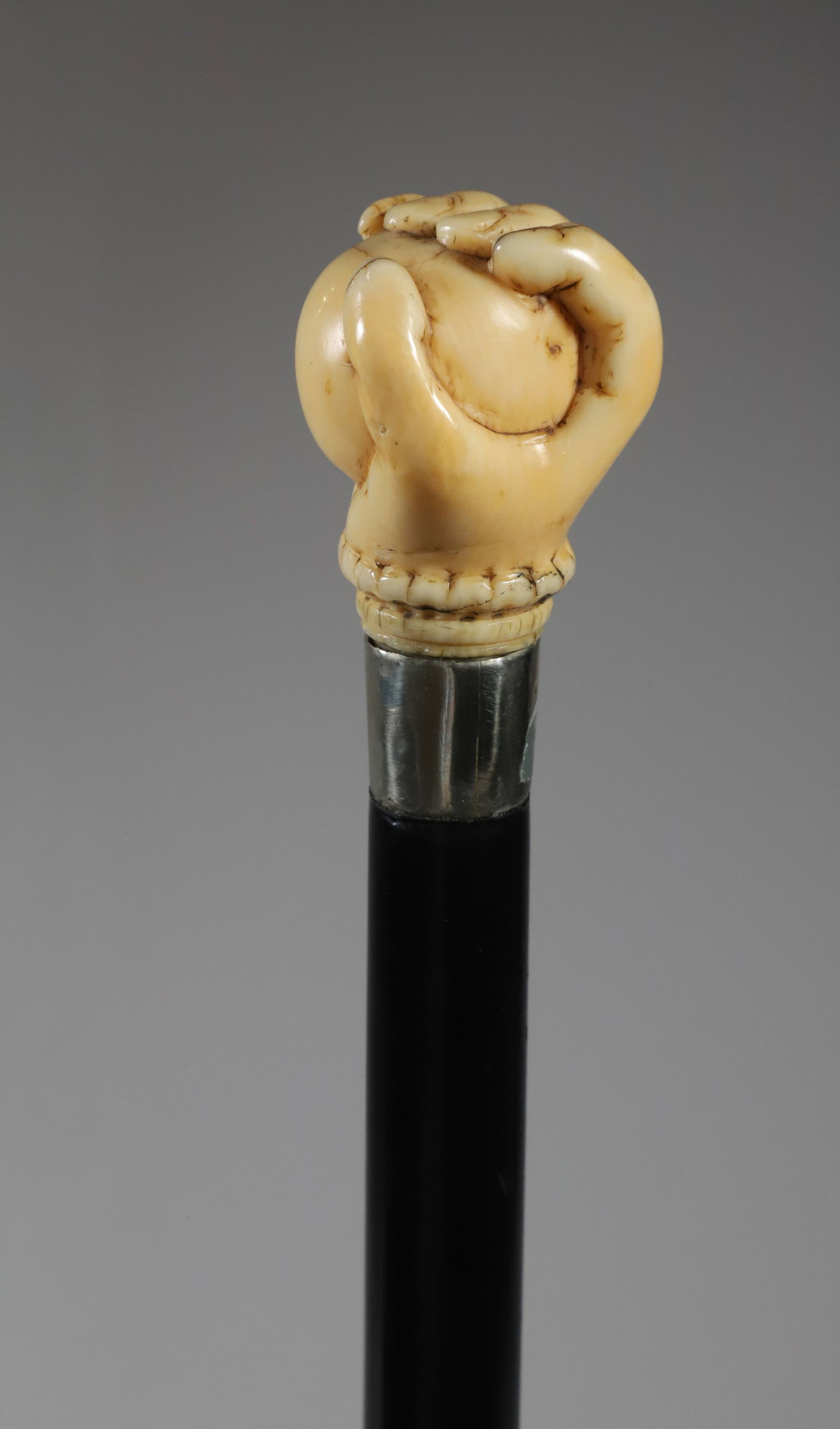 Whaleman Made Fist Clenching a Ball Walking Stick, circa 1860: Whaleman Made Fist Clenching a Ball Walking Stick, circa 1860, on ebony shaft ending in a brass ferrule. **This item is not available for international delivery. Length 36 in. Provena