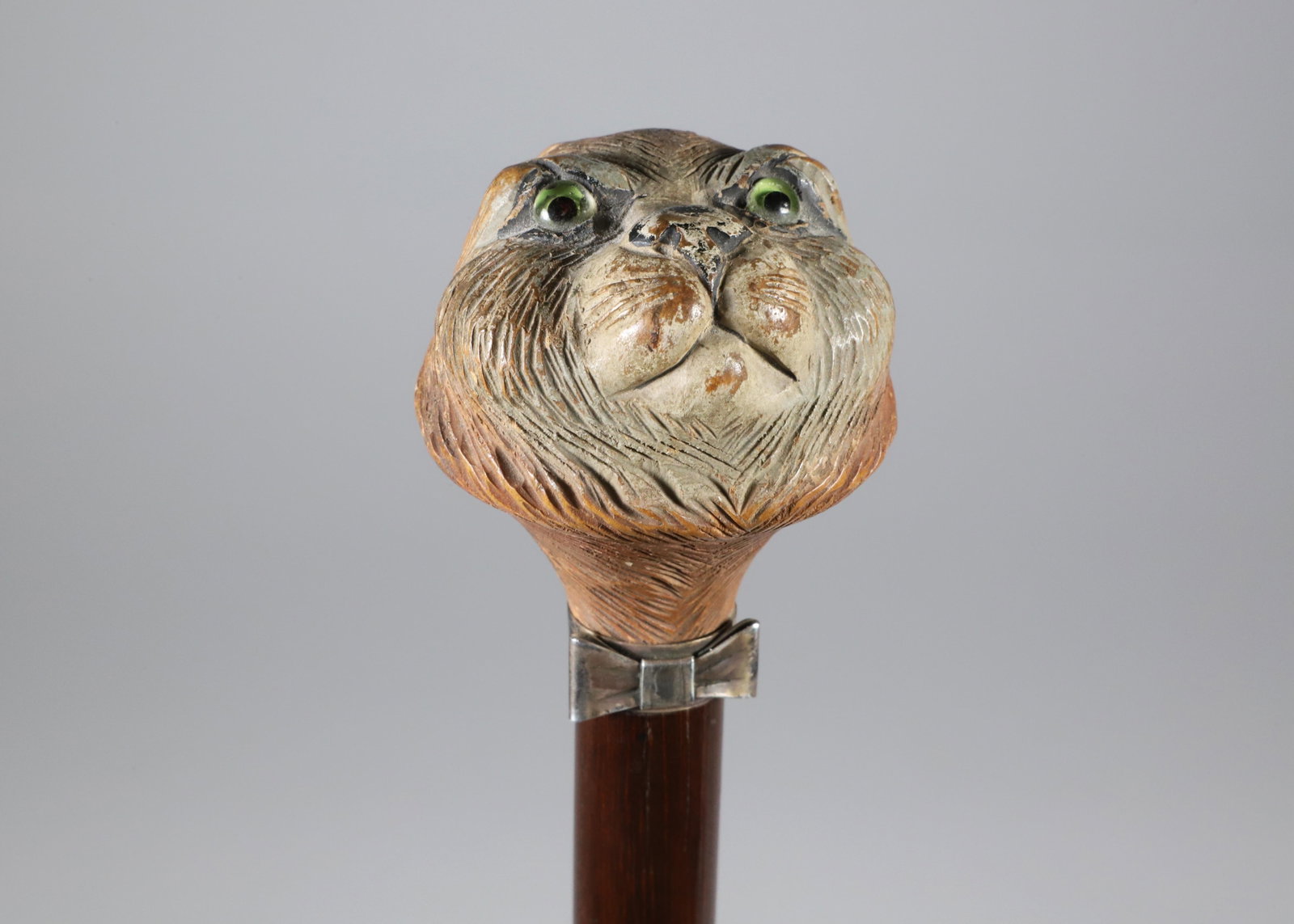 Carved Polychrome Wood Cat Head Grip Walking Stick, 19th Century: Carved Polychrome Wood Cat Head Grip Walking Stick, 19th Century, silver bow tie collar on wood shaft. Length 34.5 in. Provenance: The Estate of Herbert E. Sackett, Bristol, Rhode Island