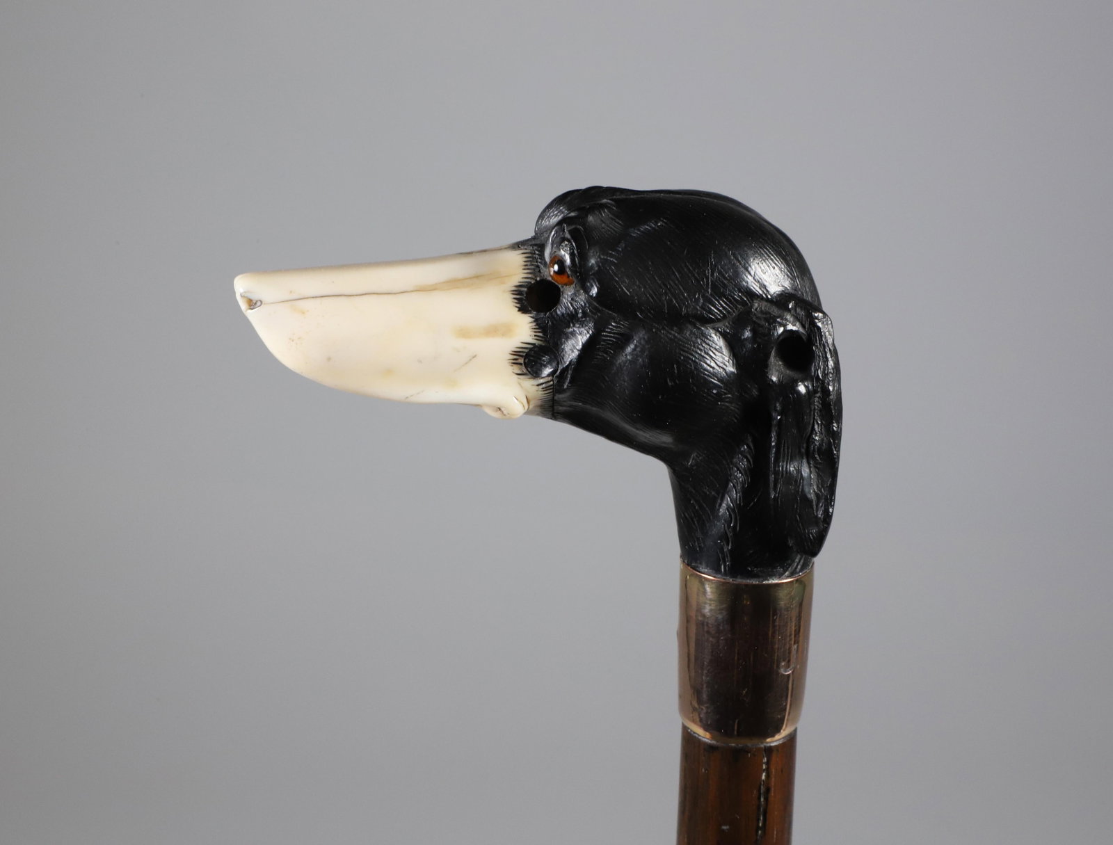 Carved Dachshund Grip Cane, 19th Century: Carved Dachshund Grip Cane, 19th Century, copper tone collar on wood shaft. **Note: This item is not available for International Delivery. Length 34 in.