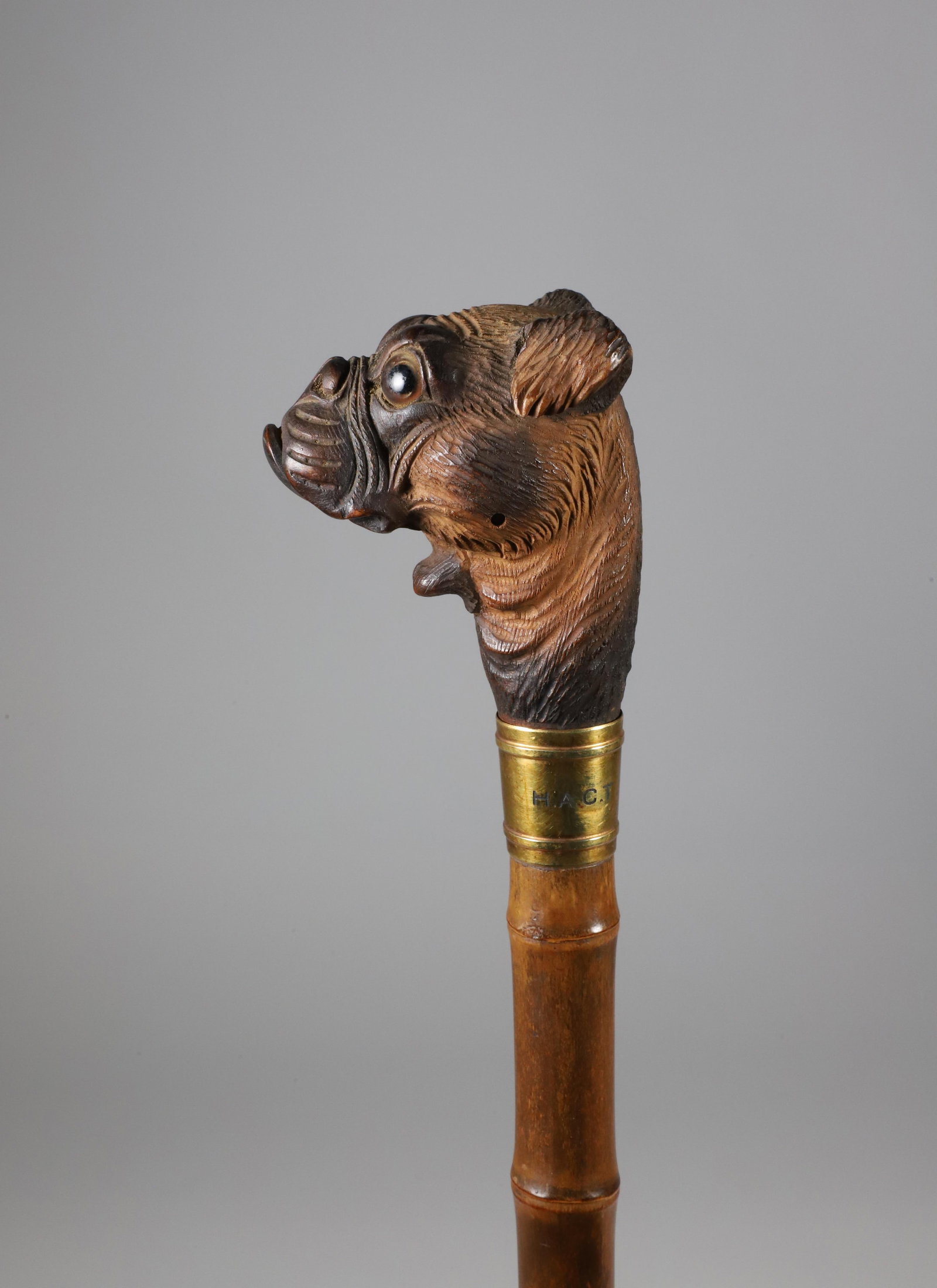 Mechanical Carved Wood Boxer Dog Walking Stick, 19th Century: Mechanical Carved Wood Boxer Dog Walking Stick, 19th Century, the lever opens the dog's mouth, brass collar engraved with initials H.A.C.T., on faux carved bamboo shaft. Note: The blue tape is to