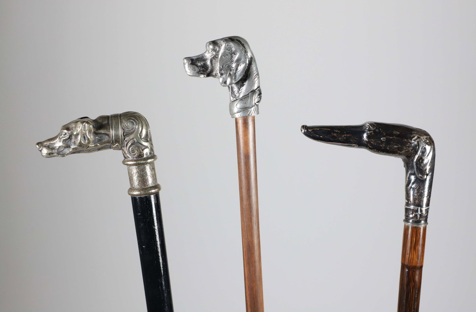 Three Vintage Metal Dog-Head Canes on Wood Shafts