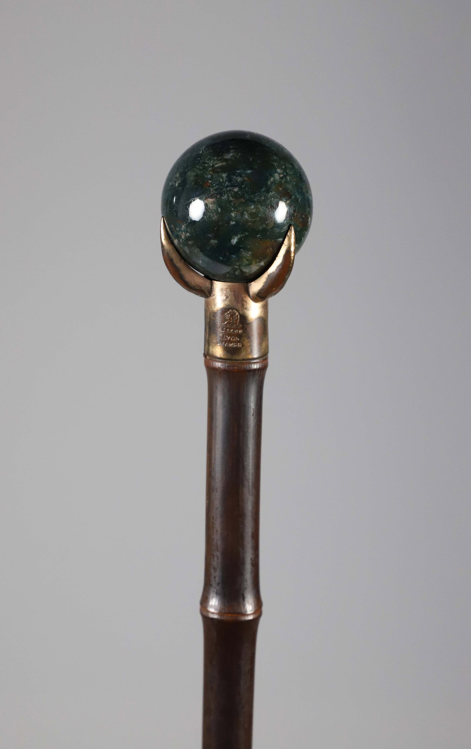 English Green Quartz Ball Walking Stick, 19th Century: English Green Quartz Ball Walking Stick, 19th Century, with brass talon mounting on bamboo shaft. Length 33.5 in. Provenance: The Estate of Herbert E. Sackett, Bristol, Rhode Island