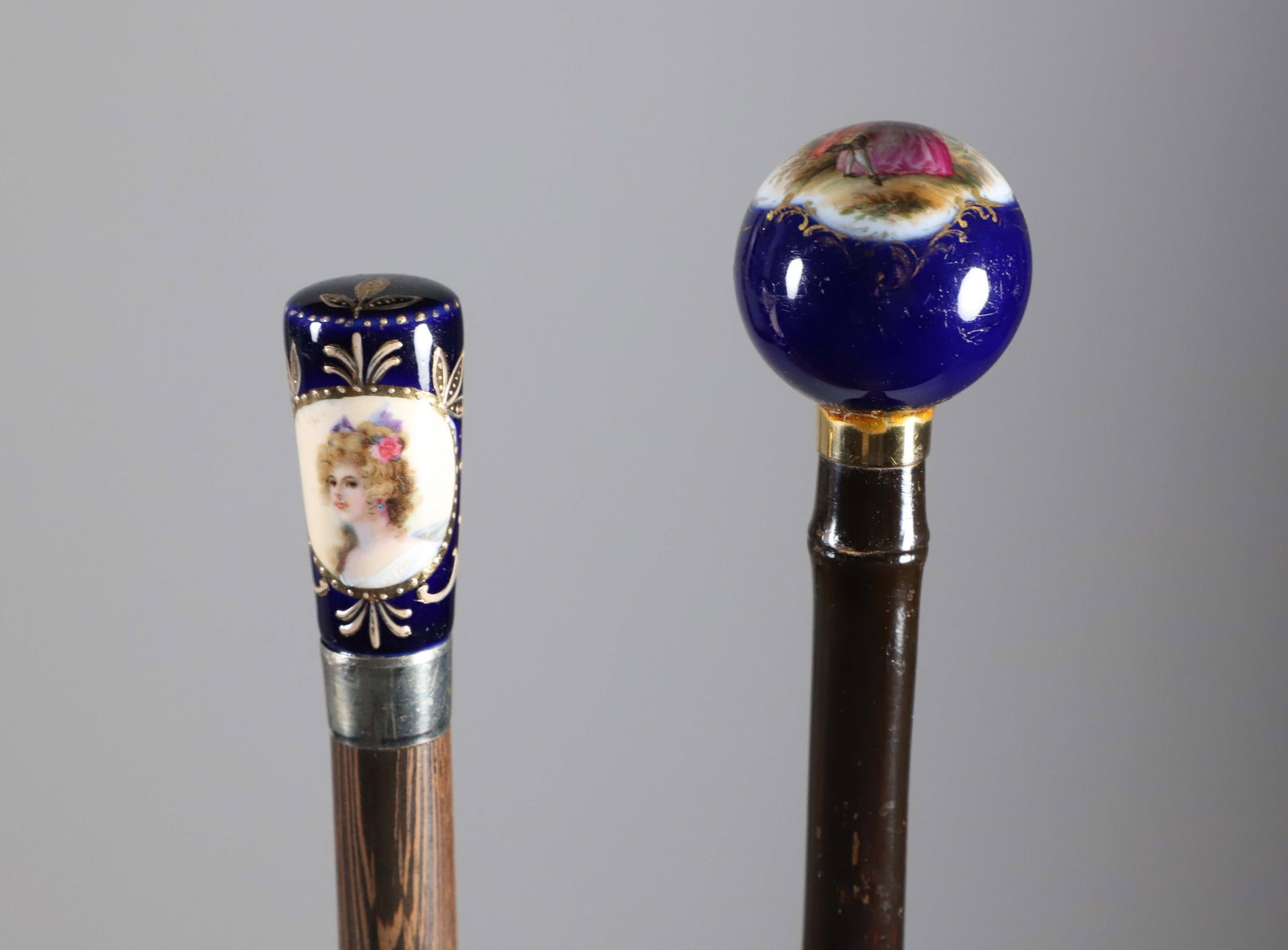 Two Hand Painted French Porcelain Portrait and Courting Walking Sticks, 19th Century: Two Hand Painted French Porcelain Portrait and Courting Walking Sticks, 19th Century, on wood shafts Lengths 36.5 in. and 35.5 in. Provenance: The Estate of Herbert E. Sackett, Bristol, Rhode Island