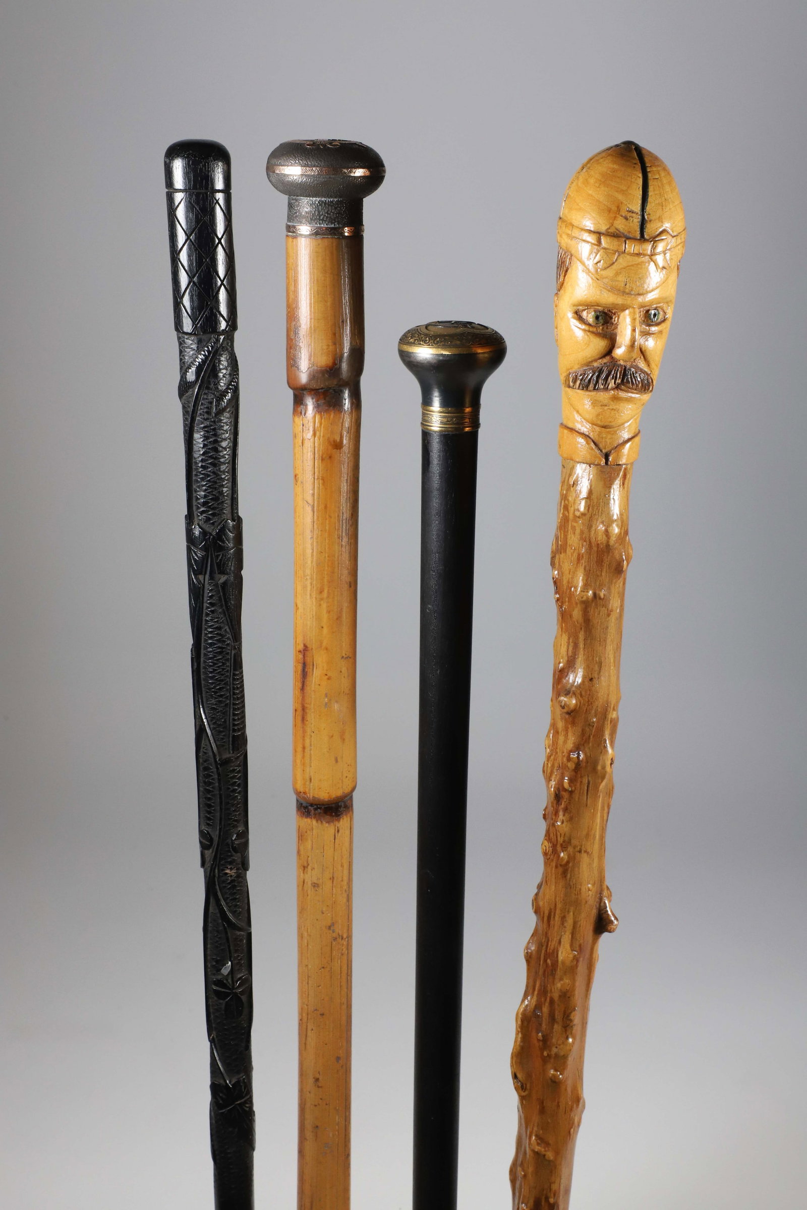 Four Vintage Assorted Metal and Carved Wood Walking Sticks