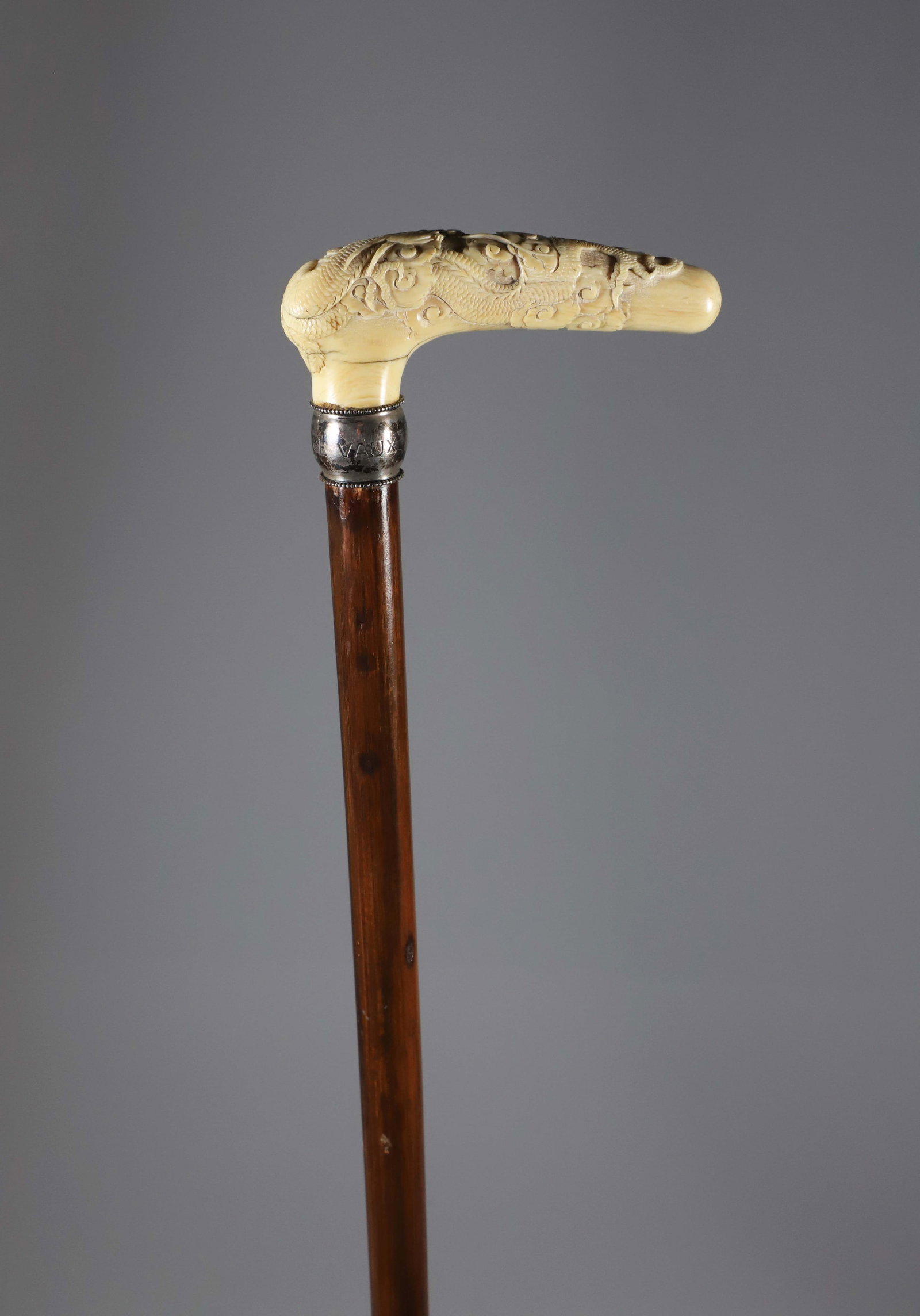 Carved Chinese Dragon Grip Cane, 19th Century: Carved Chinese Dragon Grip Cane, 19th Century, engraved silver collar on a wood shaft. **Note: This item is not available for International Delivery. Length 36 in. Pr