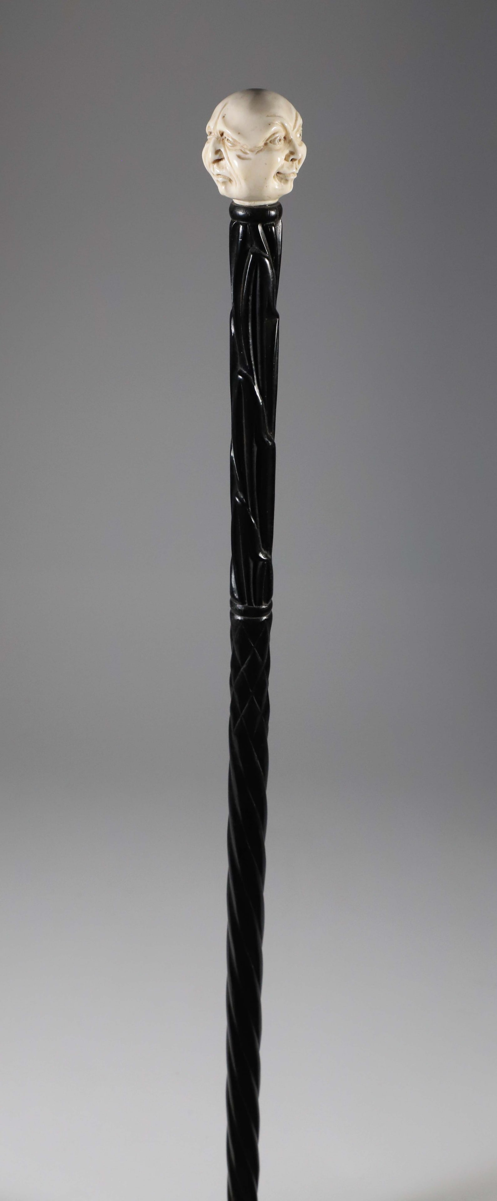 Carved Portrait Walking Stick, 19th Century: Carved Portrait Walking Stick, 19th Century, three phases grip on a carved ebonized wood shaft. **Note: This item is not available for International Delivery. Length 34 in. <