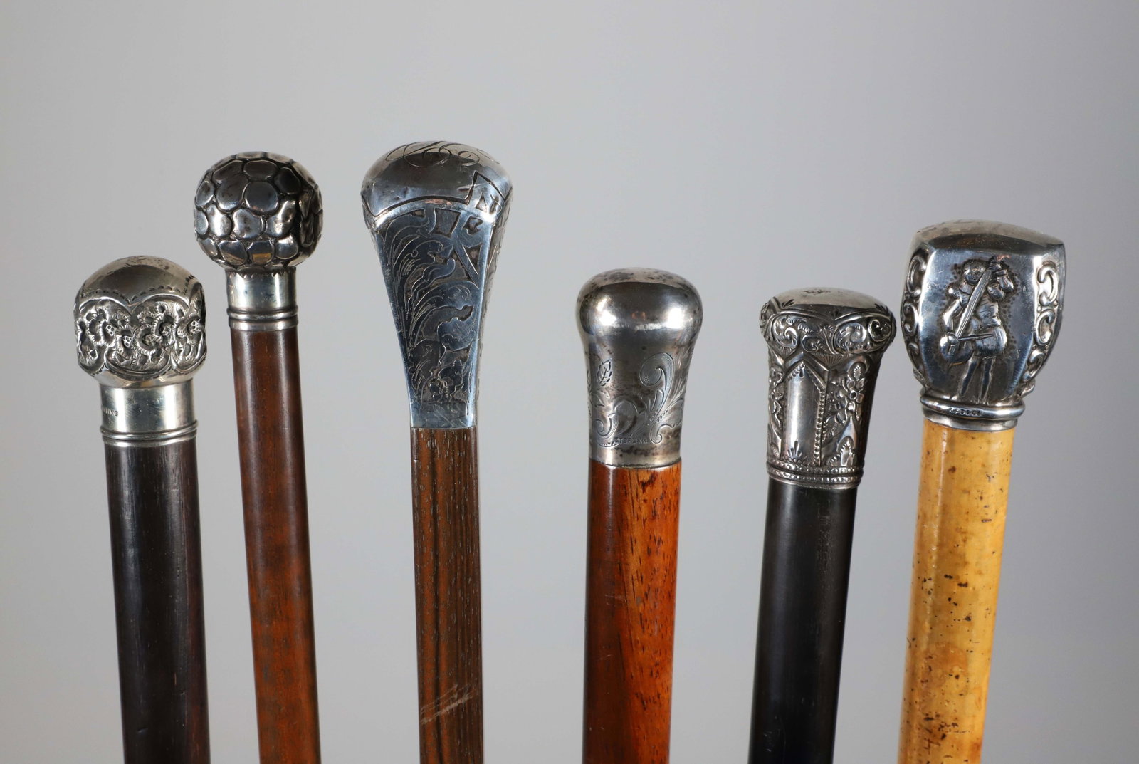 Six Repousse Sterling Silver Knob Grip Walking Sticks, 19th Century