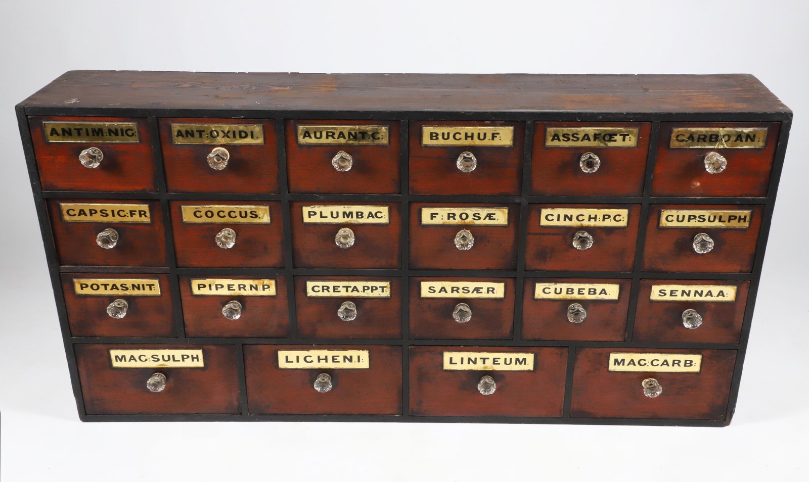 American 22 Drawer Apothecary Chest, 19th Century: American 22 Drawer Apothecary Chest, 19th Century, with name plates and glass pulls Height 25 in. Length 48 in. Depth 9 in. Provenance: The Reginald Levine Collection