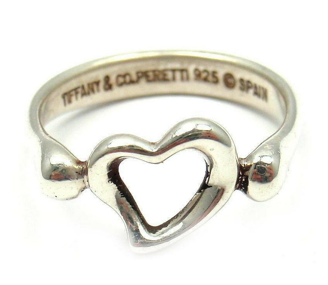 Tiffany & Co. Silver Peretti Open Heart Ring: Metal: Sterling Silver Top Width: 7.5mm Weight: 2.5g Ring Size: 5.5 (Resize Available) Hallmarks: Tiffany & Co. Peretti 925 Spain sillot512r