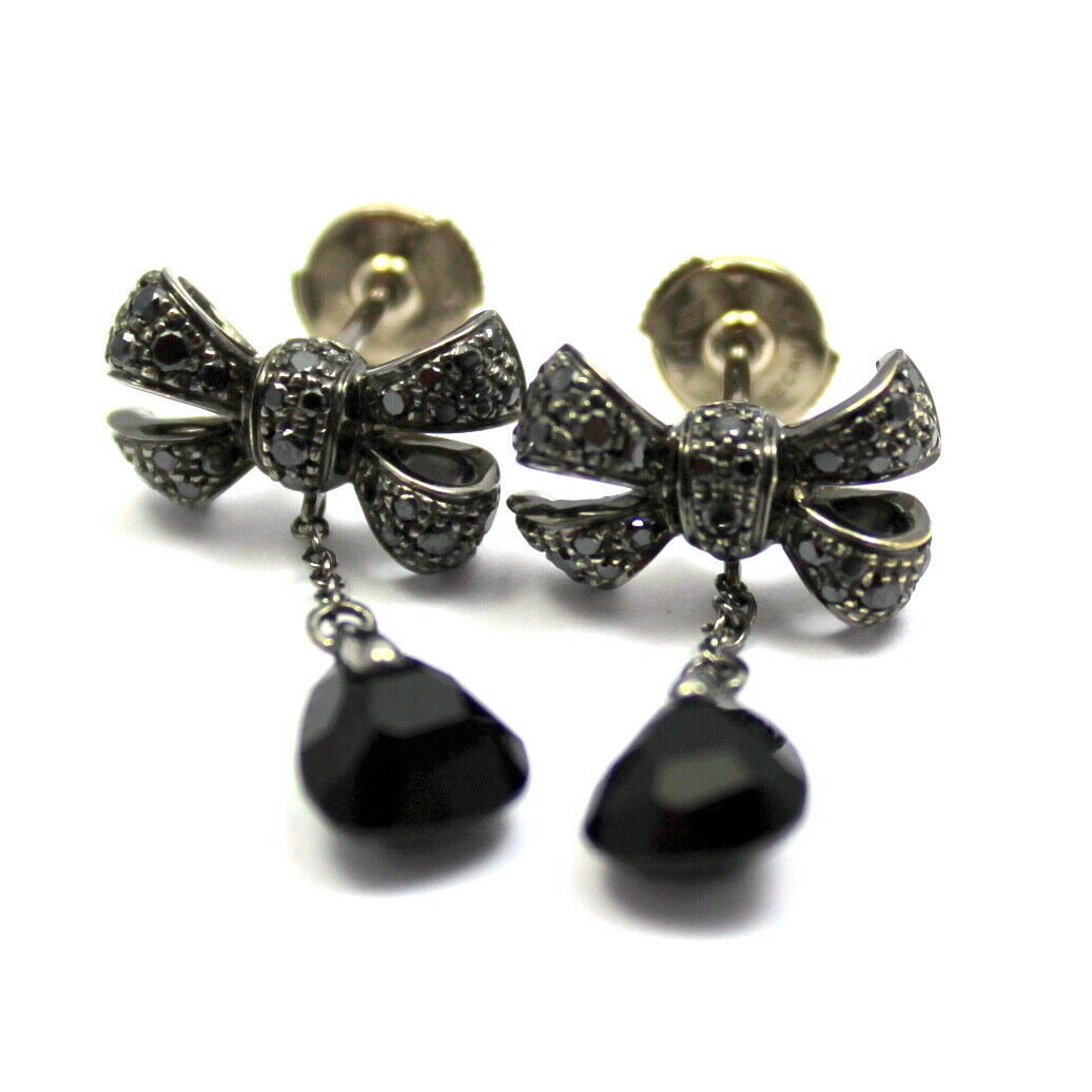 Pomellato 18k White Gold Black Diamond Onyx Drop Bow Earrings: About This Piece: About Pomellato: What with the ceiling-high glass artwork and the soft