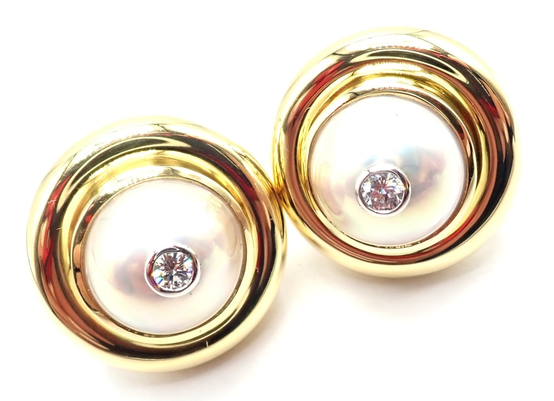 Tiffany & Co Picasso 18k Yellow Gold Diamond Mabe Pearl Earrings Paper: About This Piece: These earrings come with Tiffany & Co replacement value from 1993, a receipt and a box.