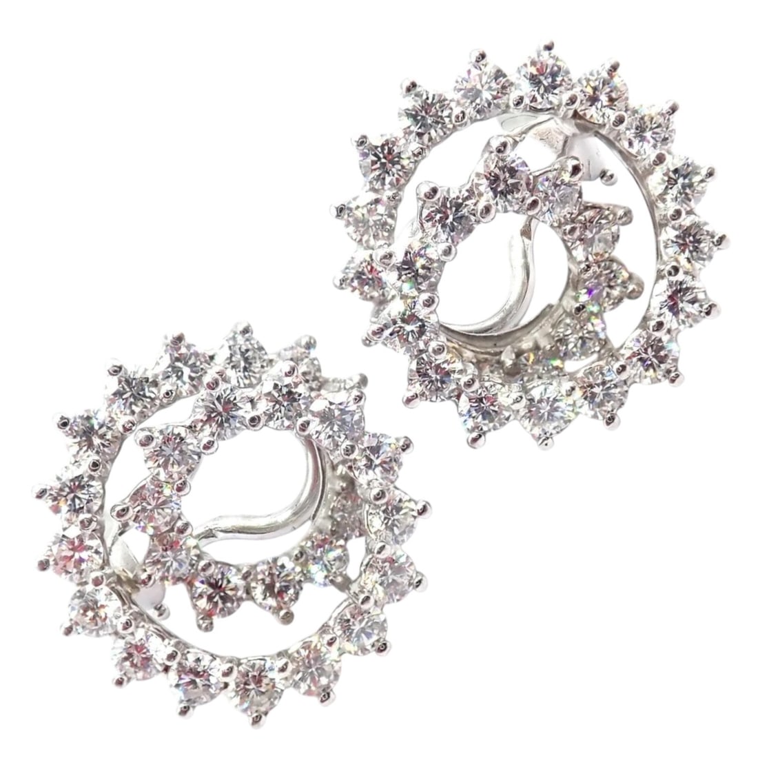 Vintage Tiffany & Co Irid Platinum Diamond Swirl Earrings: About This Piece: These authentic vintage Tiffany & Co. Irid earrings are crafted in platinum, featuring a dramat