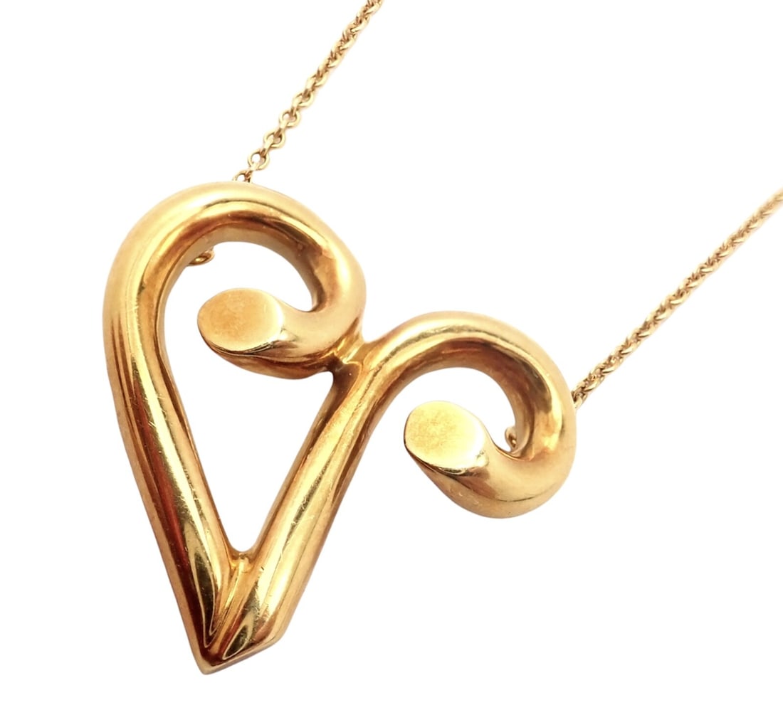 Tiffany & Co Picasso 18k Yellow Gold Large Zodiac Aries Pendant Necklace: About This Piece:Crafted in 18k yellow gold by Tiffany & Co. from the Paloma Picasso collection, this necklace features a pendant m
