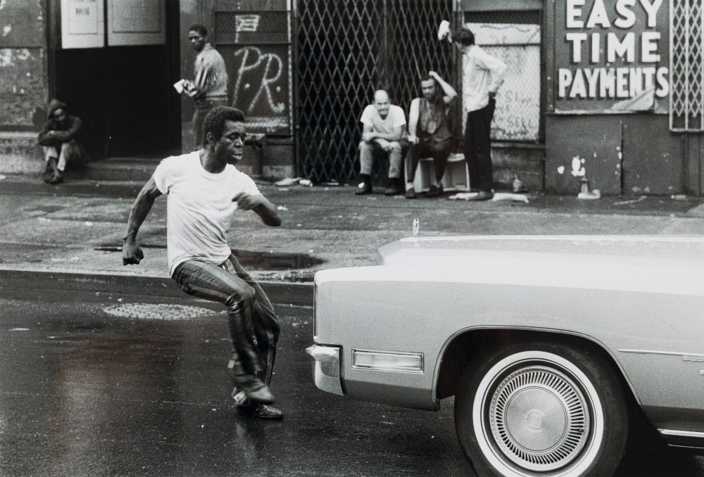 Kunitsch, Rolf: Man in Front of a Car, From the Series: New York, 1971 photography, Leica M2, on Ilford HP4 signed verso, labelled and dated on cardboard 8,3 x 12,1 in From the series "New York" from 1971. Reportage