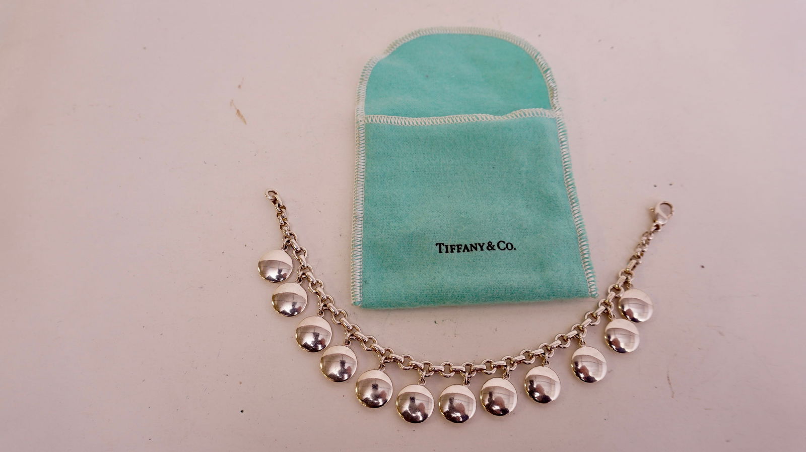 Tiffany & Company Sterling Silver hanging DISK Braclet: Tiffany & Company Sterling Silver hanging DISK Braclet