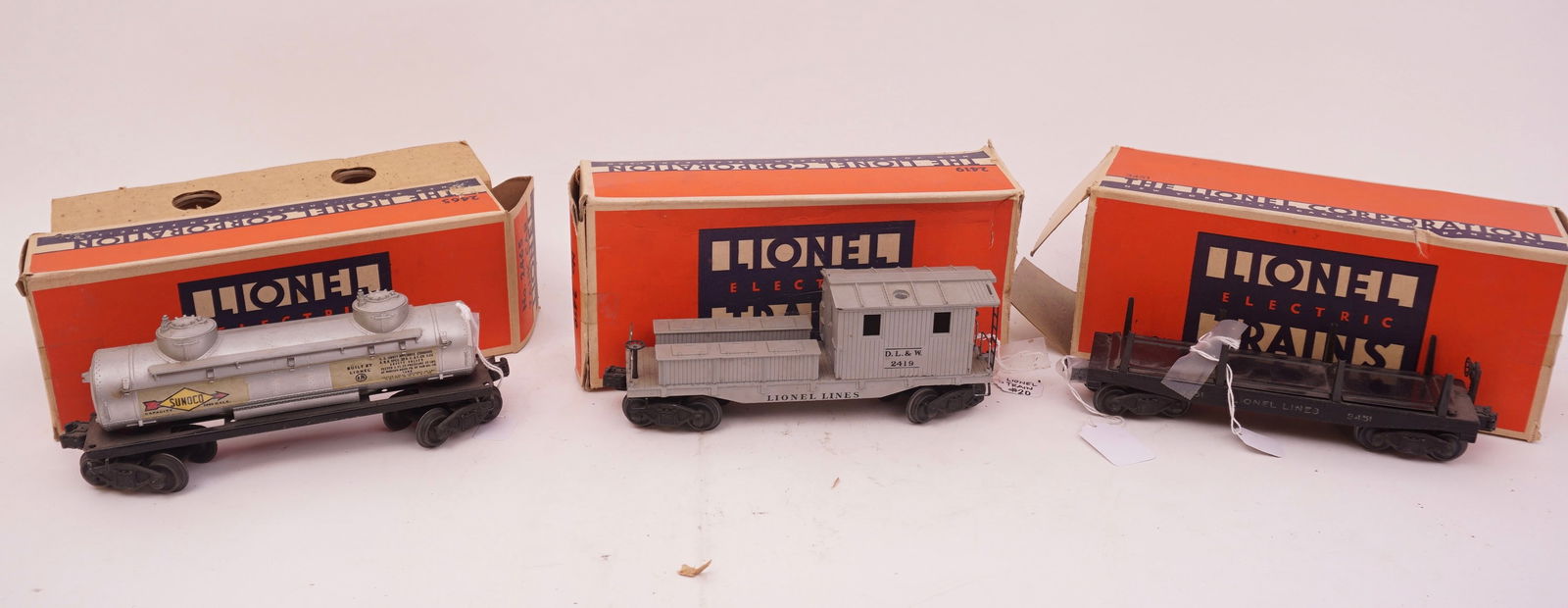 Lionel Trains Number 2419, 2465 & 3451 (2419) Recking Car (2465) Tank Car (3451)Automatic Lumber Car (1 of 1)
