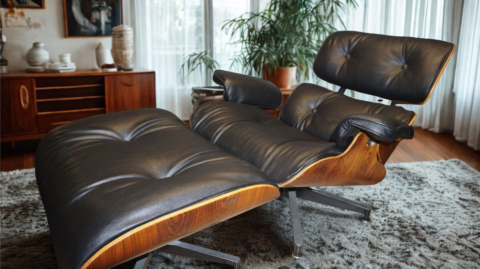 Eames Rosewood Lounge Chair & Ottoman: This chair has structural damage to it and appears to be re upholstered. Sold as is. Iconic Eames for Herman Miller lounge chair and ottoman with Brazilian rosewood shell. Classic mid-century design w