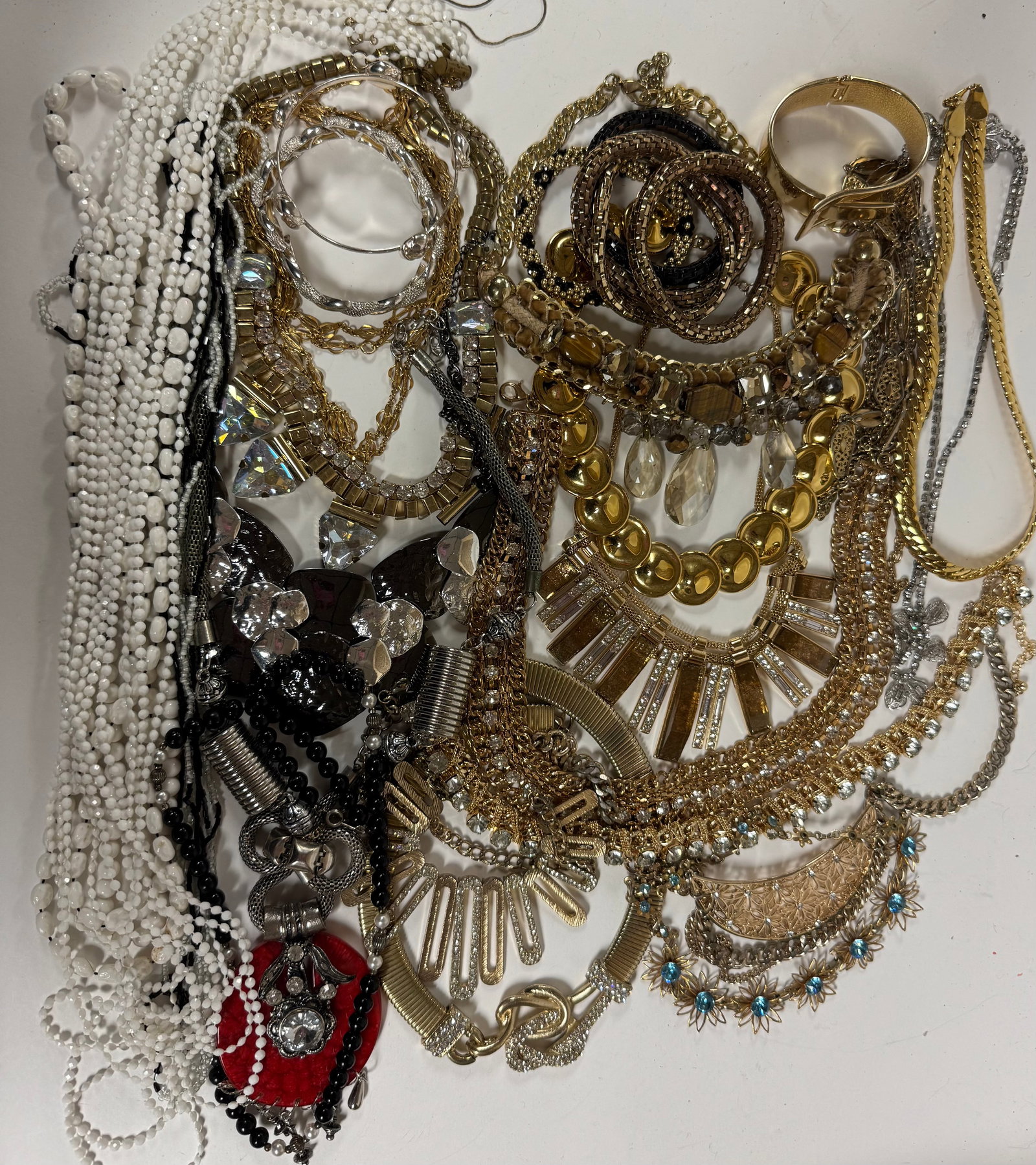 Modern Costume Jewelry Assortment: Nice modern jewelry assortment includes sculptural pieces, modern silver-tone and gold-tone designs, stones and Rhinestones. Please zoom in for exact contents.