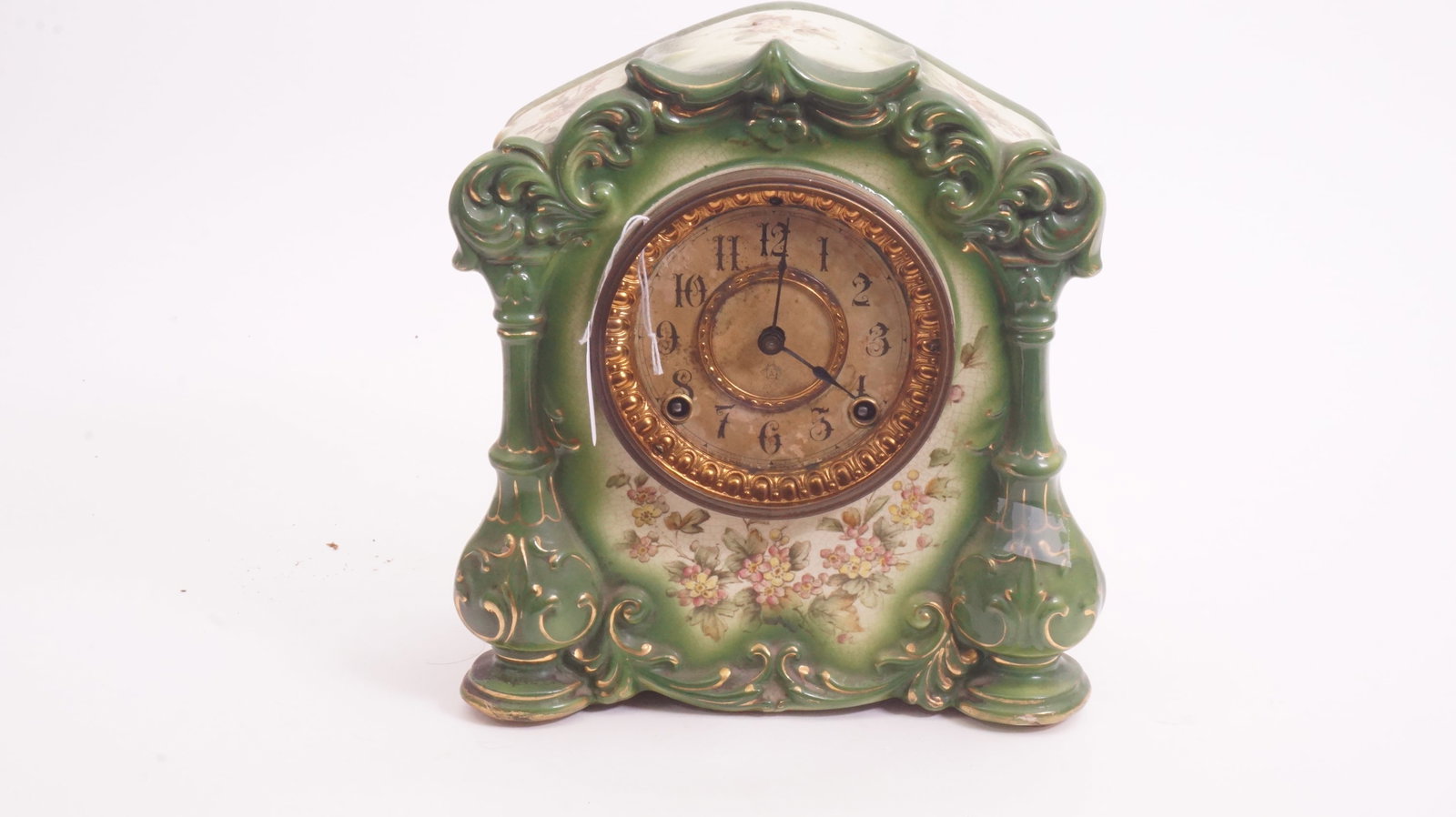 Royal Bonn Porcelain Mantel Clock: Antique Royal Bonn porcelain mantel clock with ornate painted decoration.