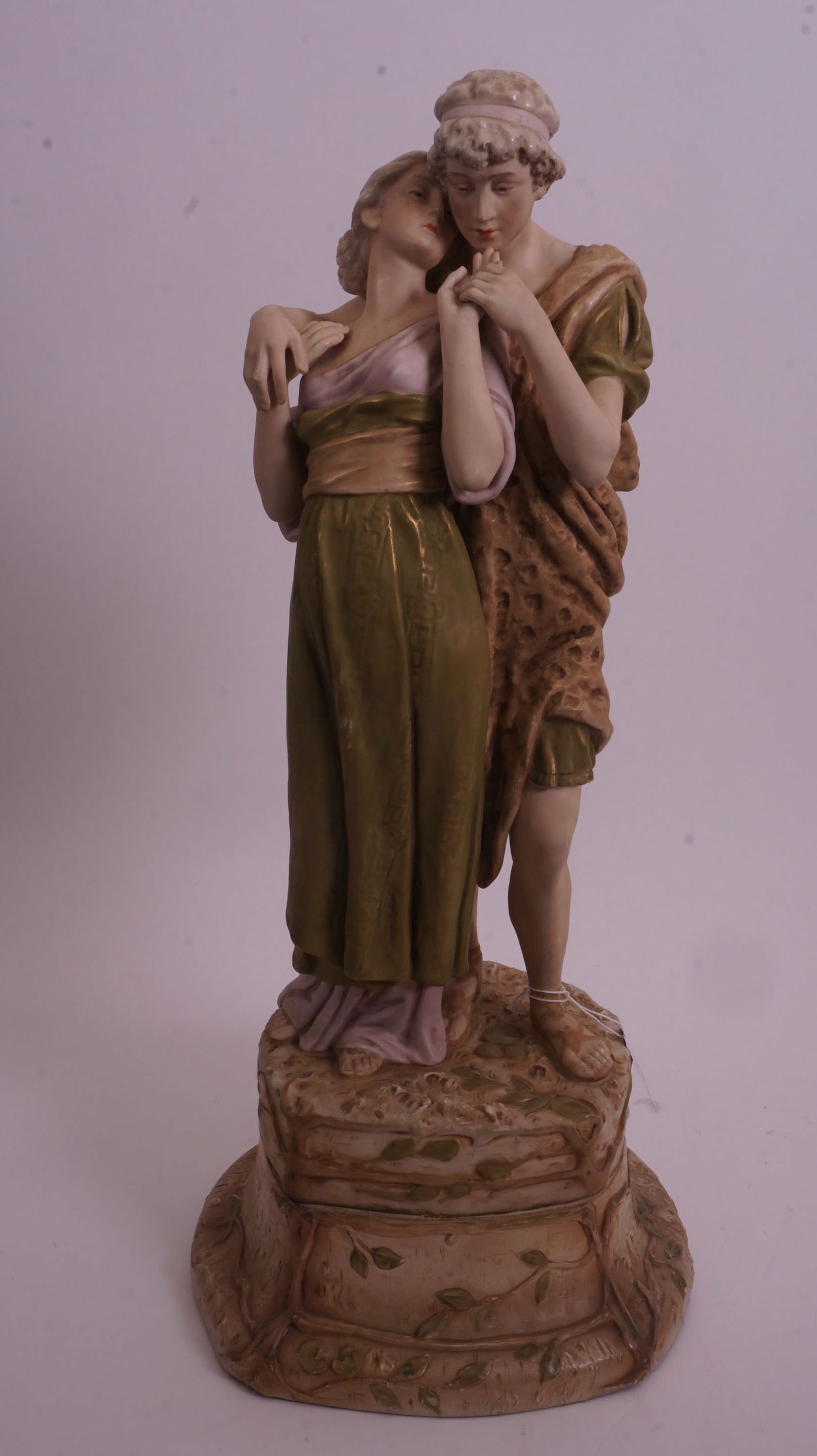 Royal Dux Figurine, Man & Woman: Royal Dux porcelain figurine featuring a man and woman in classical dress. Elegant hand-painted detail and refined form. Please review photos.