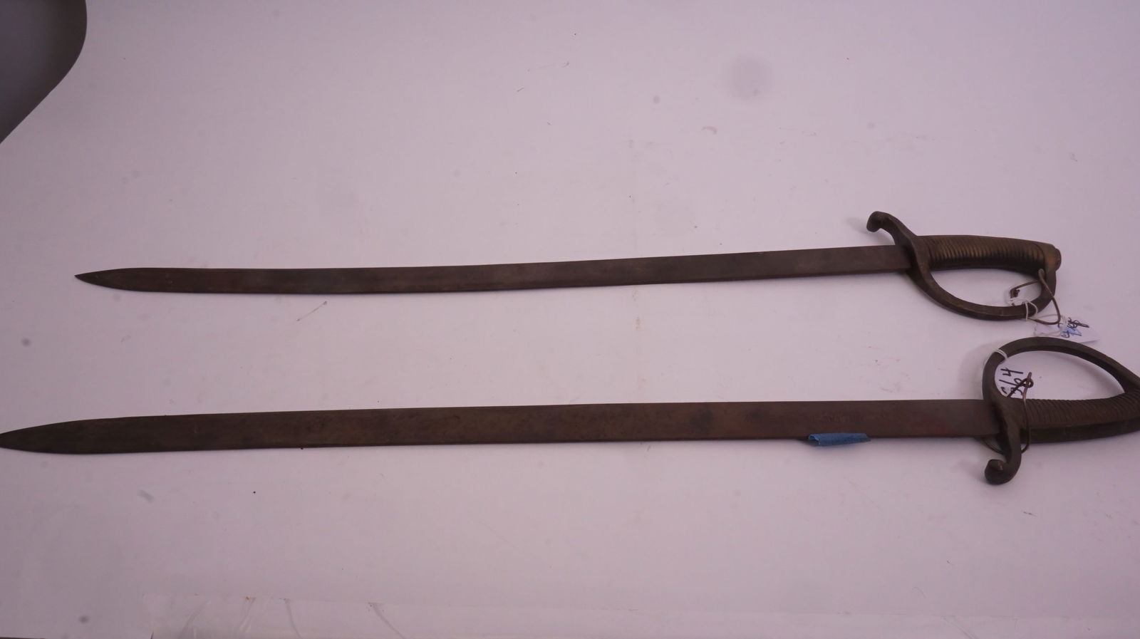 Pair of Spanish Dueling Swords: Pair of Spanish decorator dueling swords with ornate handles. Each measures approx. 32" long. Please review photos.