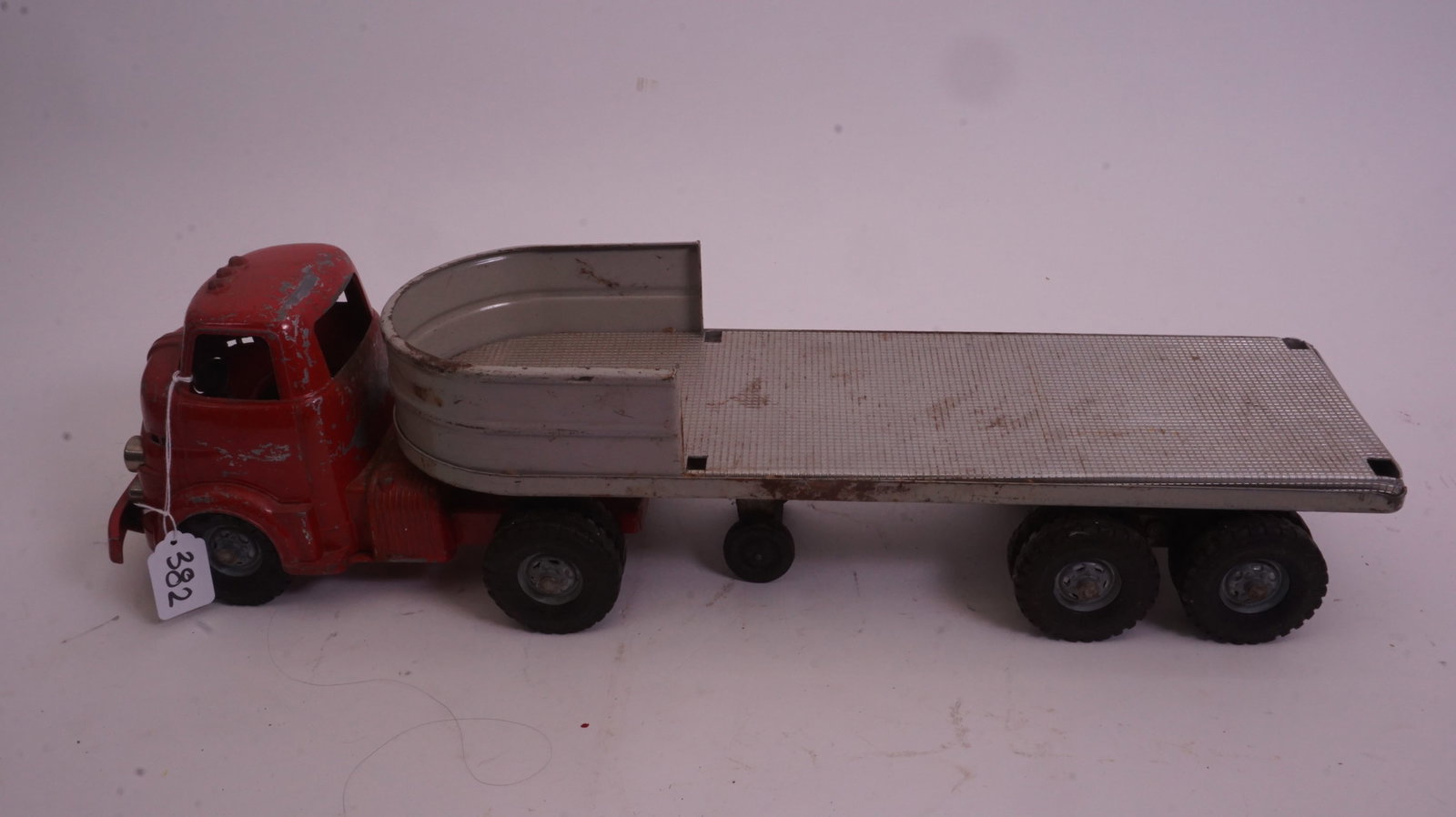 Antique Toy Truck: Antique pressed-steel toy truck with early construction styling and aged patina. Please review photos.