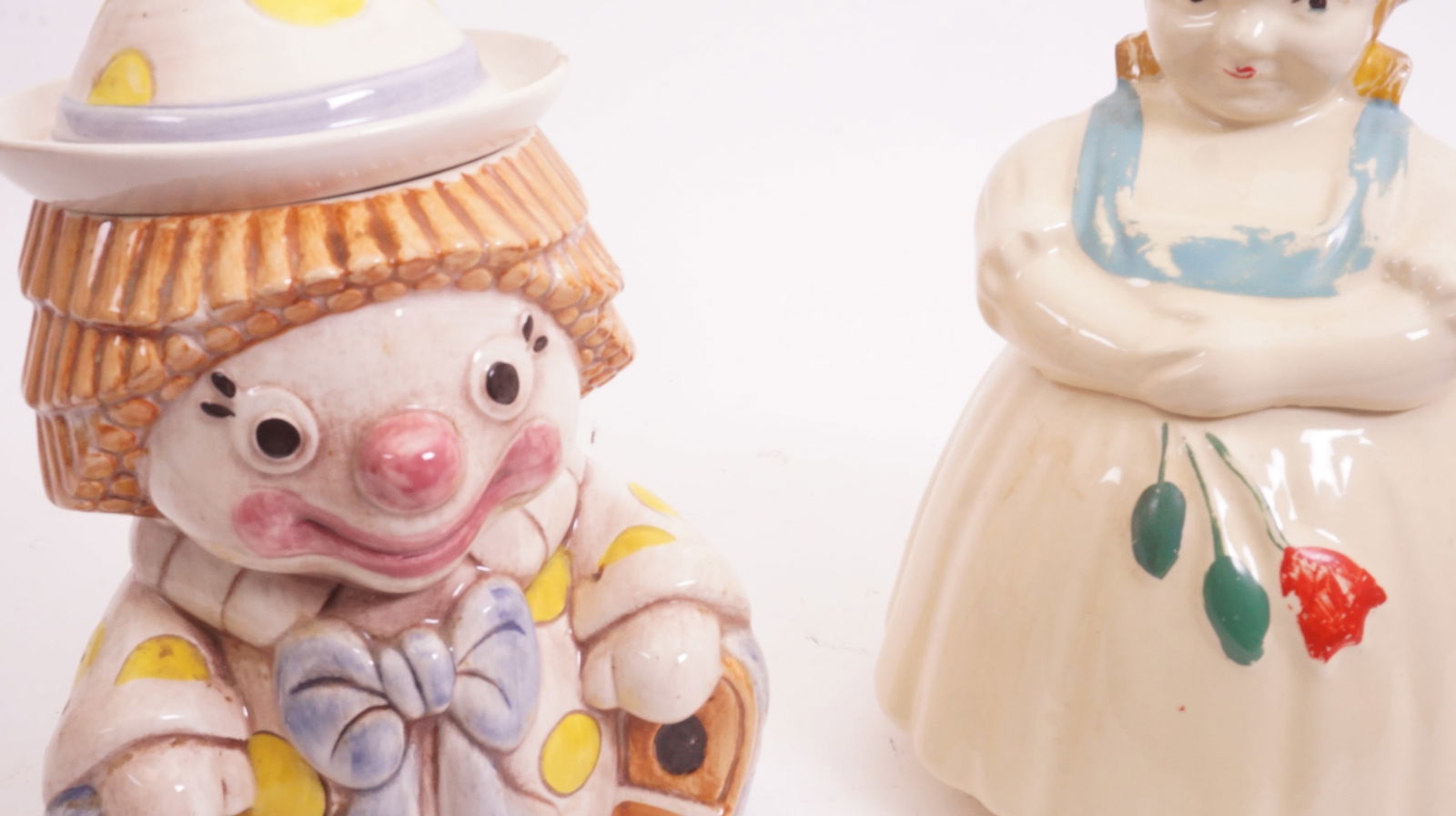 2 Cookie Jars: Two decorative cookie jars, measuring approx. 13" × 13".