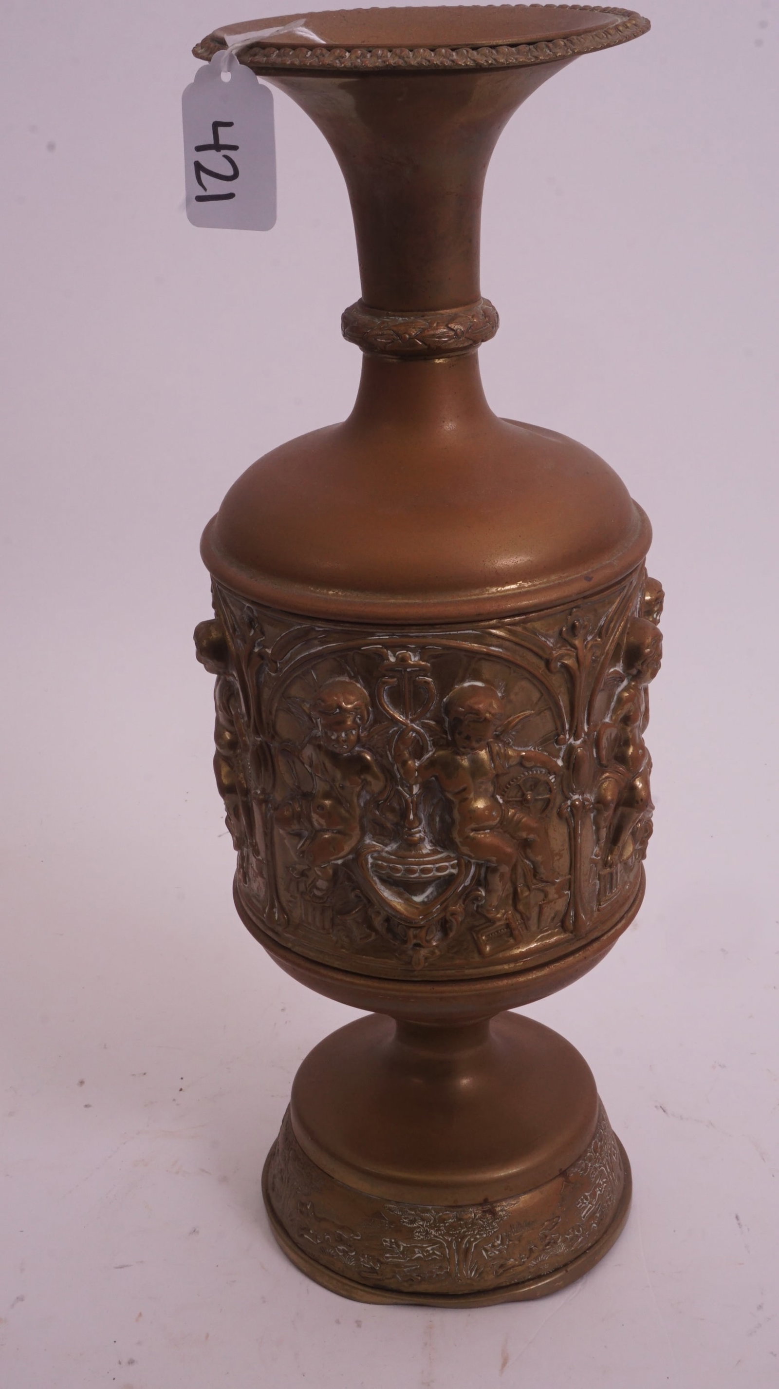 Victorian Brass Relief Vase: Victorian figural relief brass vase with ornate detailing.